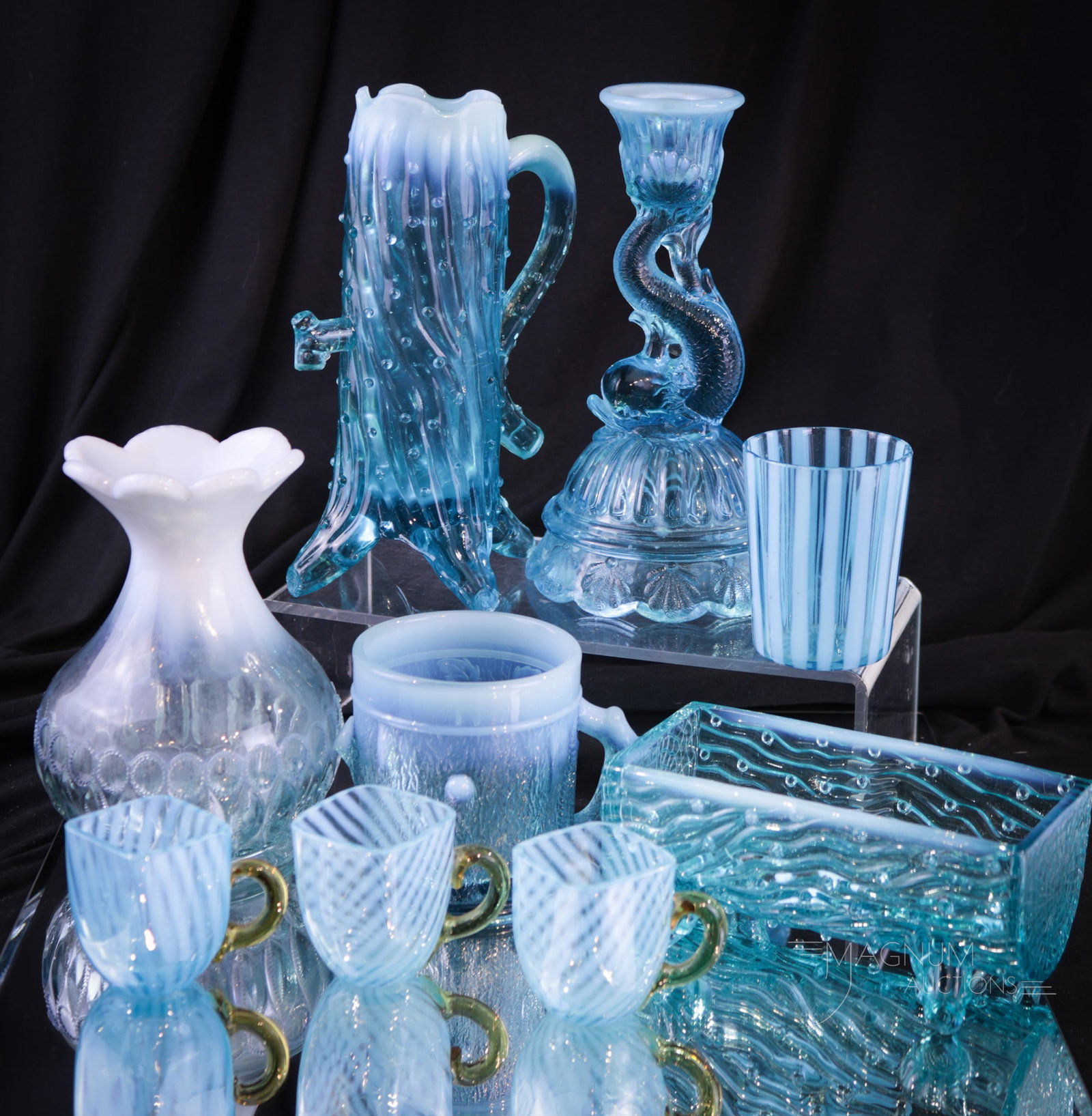 9 pc Lot of Splendor Blue Opalescent Victorian Glass: Nine select finds in Victorian blue opalescent glass. Something for everyone in this splendiferous lot of blue opal glass. Varianna in forms and functions abound. Tallest measures 6 3/4". Trough with 