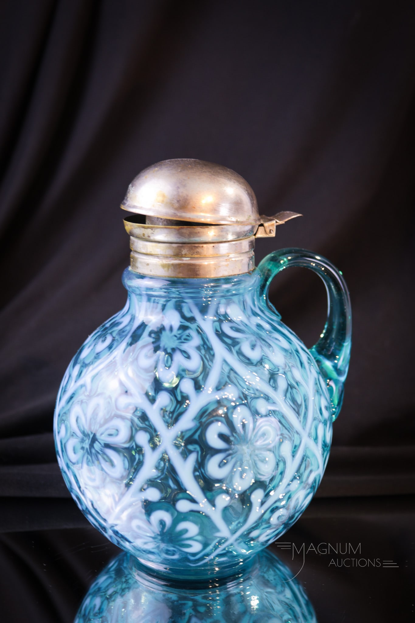 Victorian Blue Opalescent Daisy in Criss-Cross Syrup Pitcher: Take note of the wonderful color of this fine Victorian syrup in the Daisy in Criss-Cross pattern. A real beauty folks! This syrup measures 6" tall.