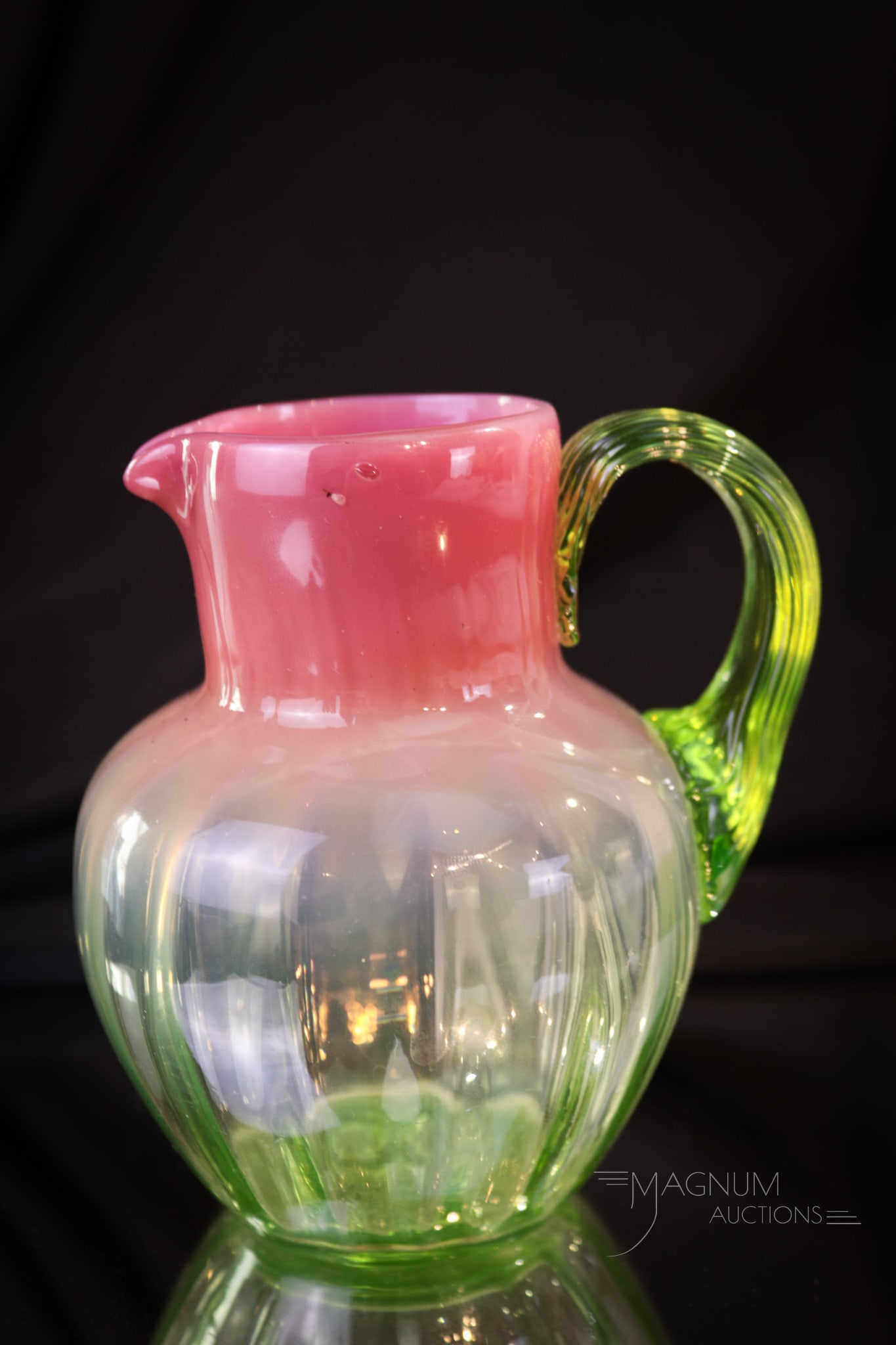 Victorian Pink Opalescent Vaseline Glass Mini 4" Pitcher: What a little cutie this little piece is! This miniature pitcher is deep rosey pink color fading to a wonderful green-vaseline glass. Pitcher measures in at only 4 1/4" tall.