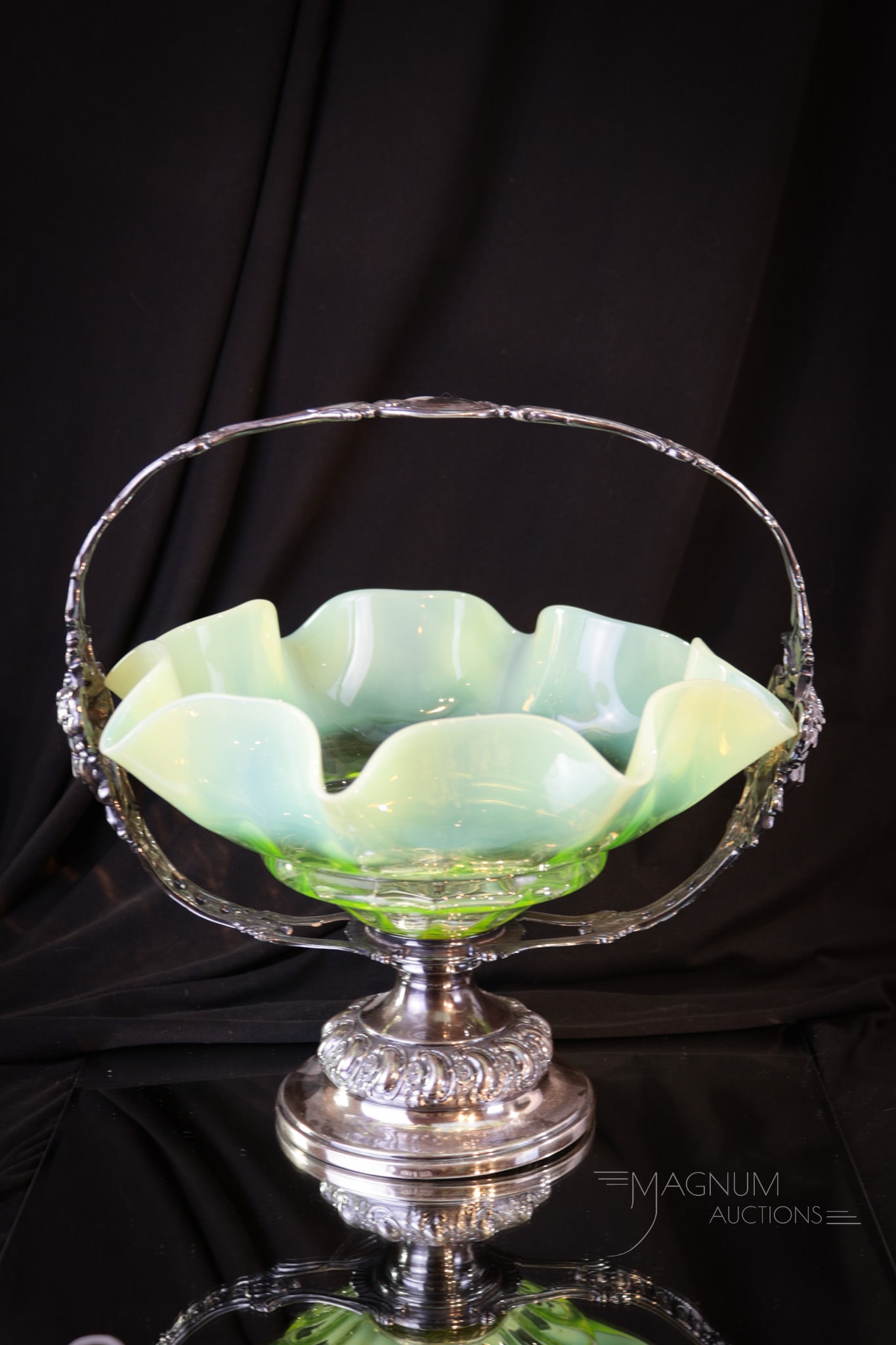 Vaseline Opalescent Silverplate Victorian Brides Bowl Basket: Extremely elegant Victorian Art Nouveau styled silverplate brides basket complete with Minerva heads on either side of the handle. Original bowl is mounted with an ornate silverplate button in the bas