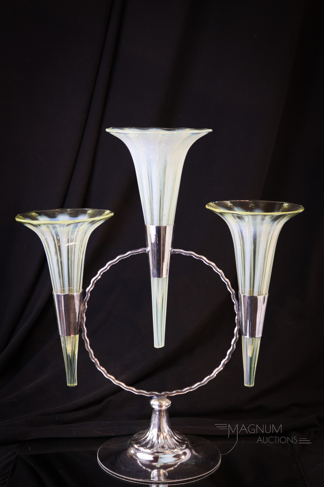 Victorian Vaseline Opalescent Stripe Silverplate Epergne: A triple epergne in ribbed for pleasure vaseline opalescent glass set in English silver plated holder. This fine piece stands tall at 13 1/2" and 11 1/2" wide. Very nice. A form seldom seen.