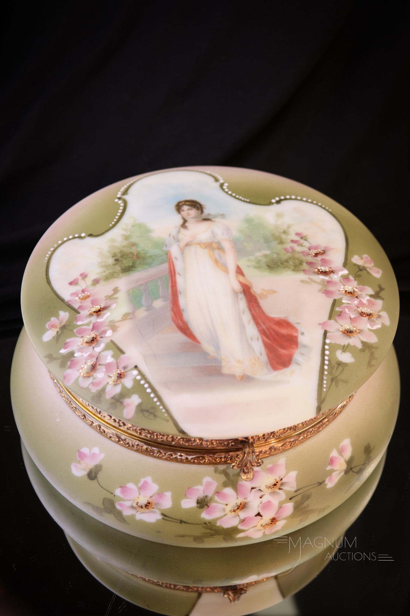 Large 7 1/2" Signed Nakara Wavecrest "Queen Louise" Dresser Box: A large and showy and very desirable signed Nakara Wavecrest 7 1/2" diameter dresser box with "Queen Louise" decoration. Piece in green ground with floral decoration. Box measures 3 1/2" tall, 7 1/2"