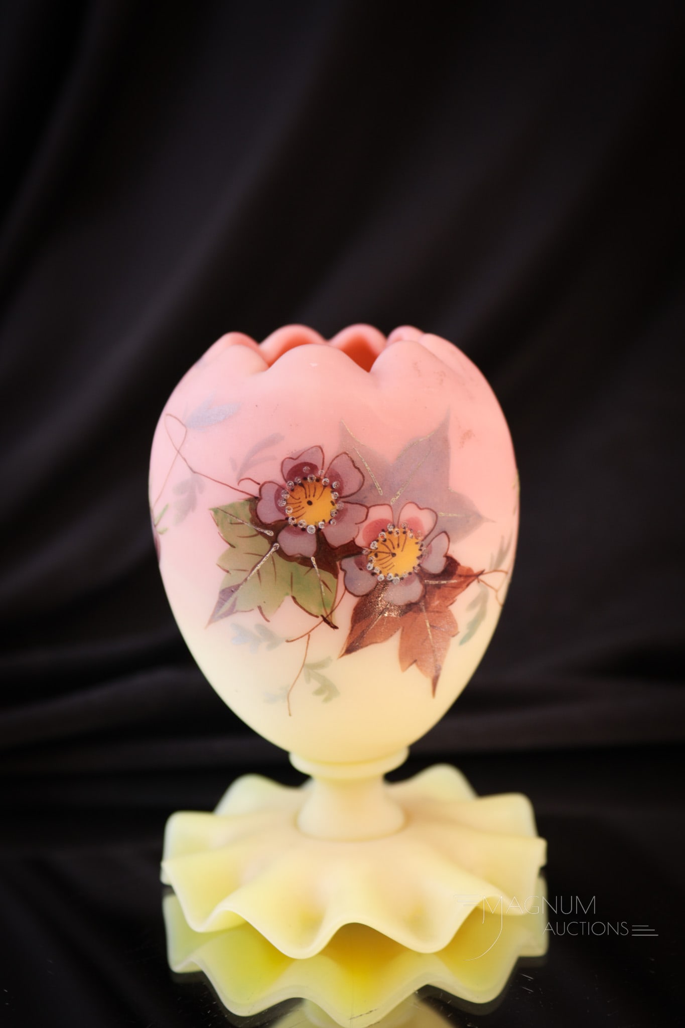 Webb Burmese Victorian Glass Footed Posey Vase: Sweet little ruffled cupped-in top and base Victorian Webb burmese glass posey vase. This fine piece is decorated with enameled florals. Vase measures 3 1/2" tall.