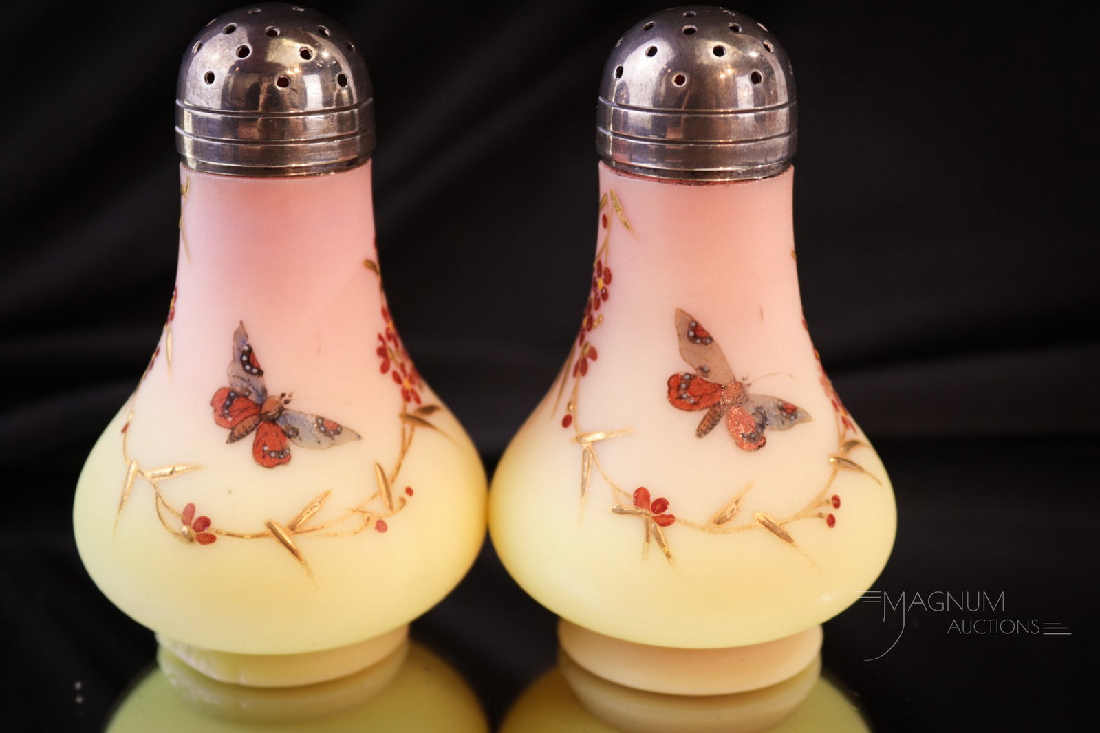 Webb Burmese Victorian Glass Ebnameled Glass Shaker Pair: Seldom found pair of Webb decorated burmese Victorian Glass shakers. These are exceedingly rare and in wonderful condition. Each measures 3 1/2" tall.