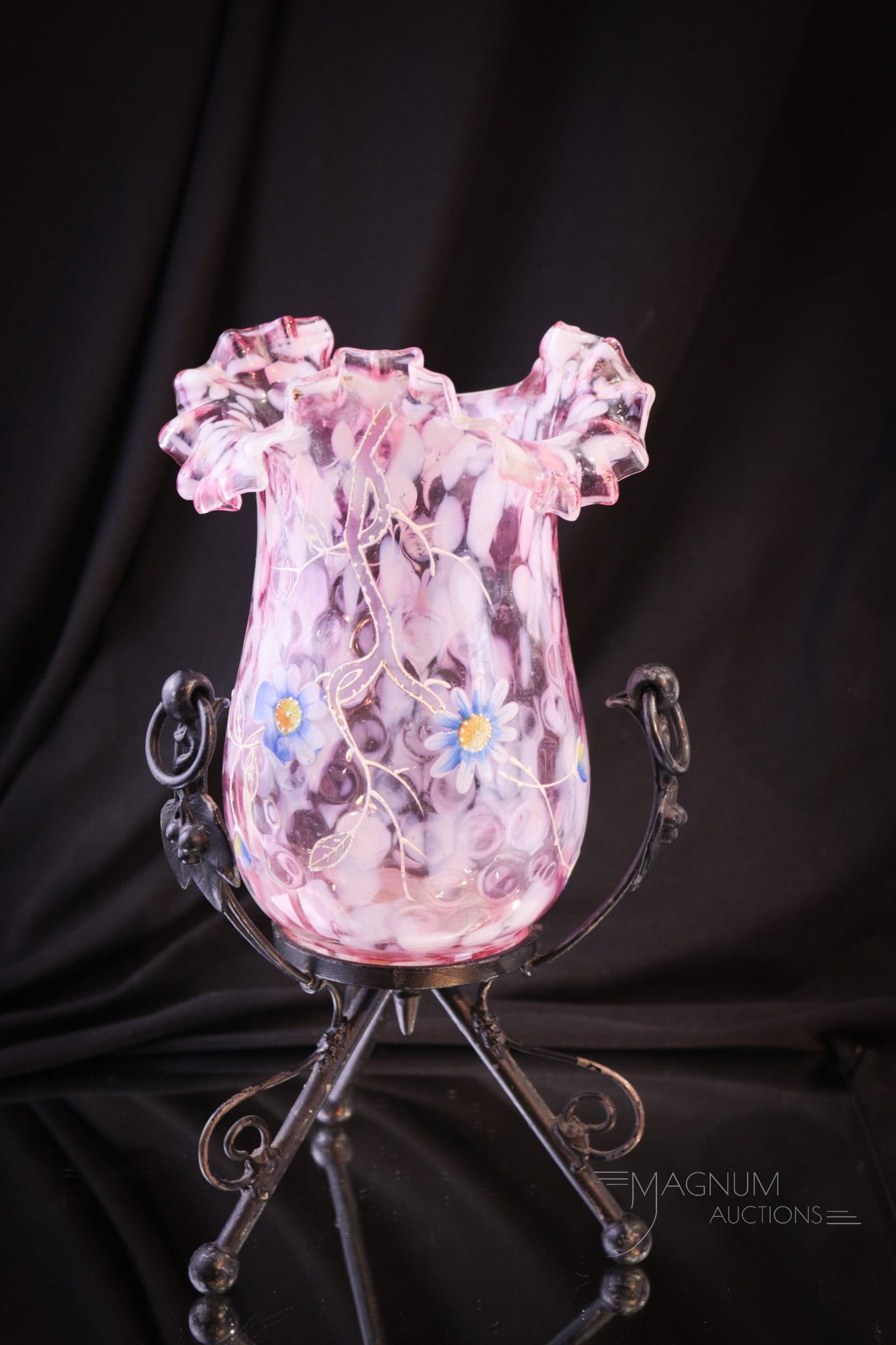 Reed & Barton Victorian Silver Plate and Spatter Glass Celery Vase: Beautiful cranberry and white splatter glass with enameled florals makes up this fine Victorian celery vase set in signed silverplate holder marked Reed & Barton. Complete this piece measures 8" tall.