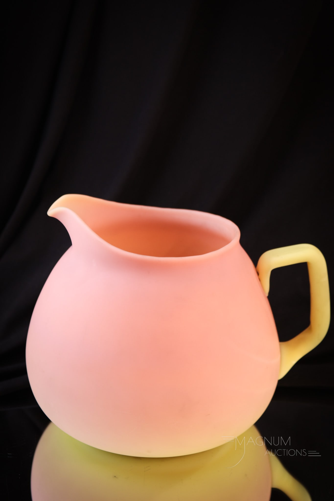 Mt. Washington Victorian Burmese Glass Cider Jug: Lovely burmese coloring is found on this Mt. Washington glass cider jug. This piece is always a pleasure to see and even better to own. Jug measures 6" tall. Provenance: This item is from the private 