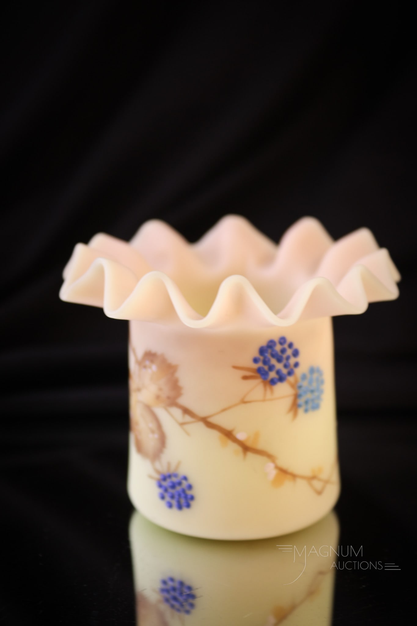 Mt. Washington Victorian Burmese Glass Toothpick Holder: Select example of a blue berry decorated Victorian Mt. Washington burmese glass toothpick holder. This one with ruffled top rim. Toothpick holder measures 2 1/4" tall. Provenance: This item is from th