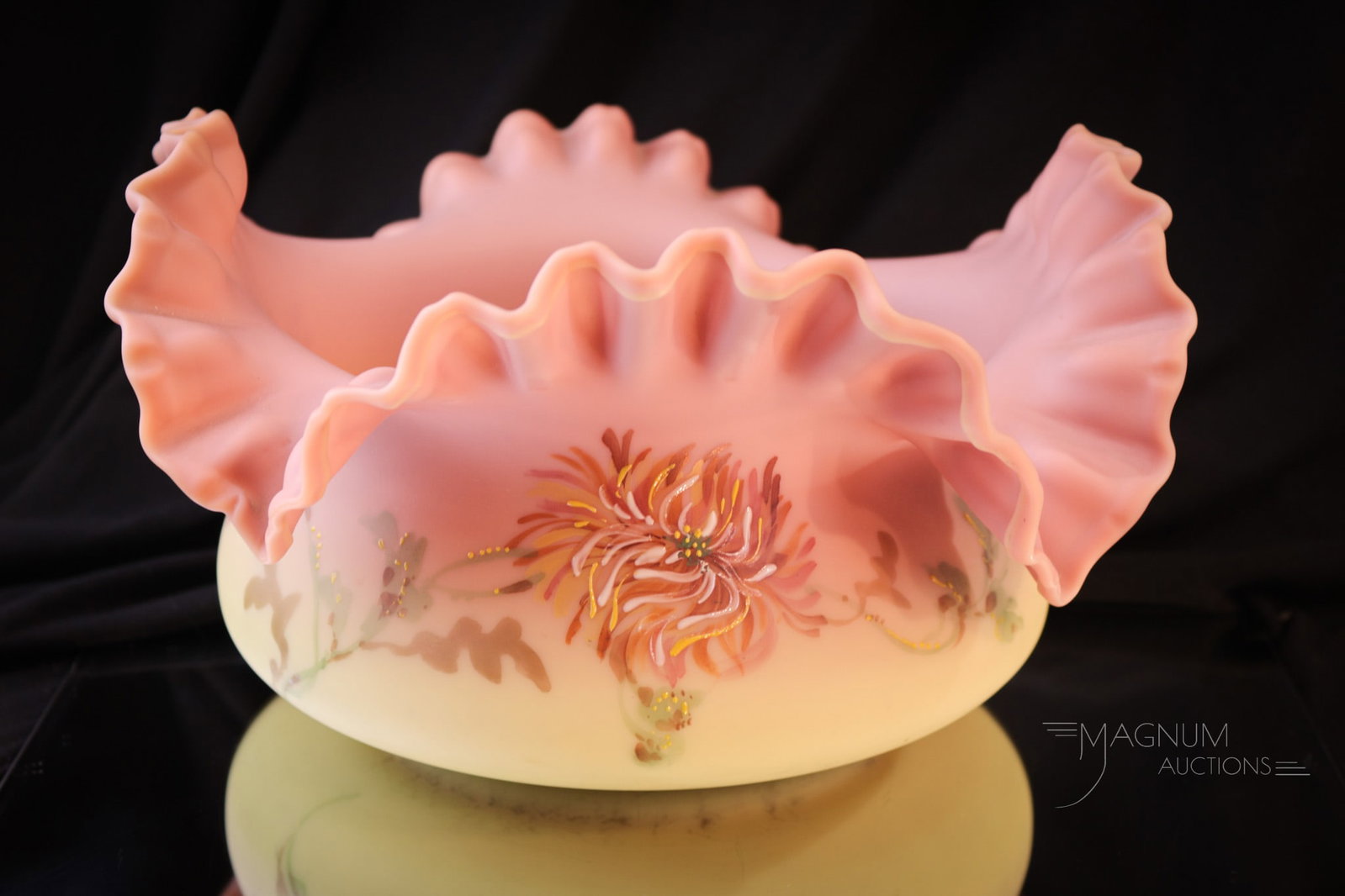 Mt. Washington Burmese Glass 10" Decorated Brides Bowl: What a beautiful piece of Mt. Washington glass. This brides bowl in Victorian burmese glass is decorated with spider mum decoration and foliage. Deeply ruffled rim. Bowl measures 5 1/2" tall, 10" diam