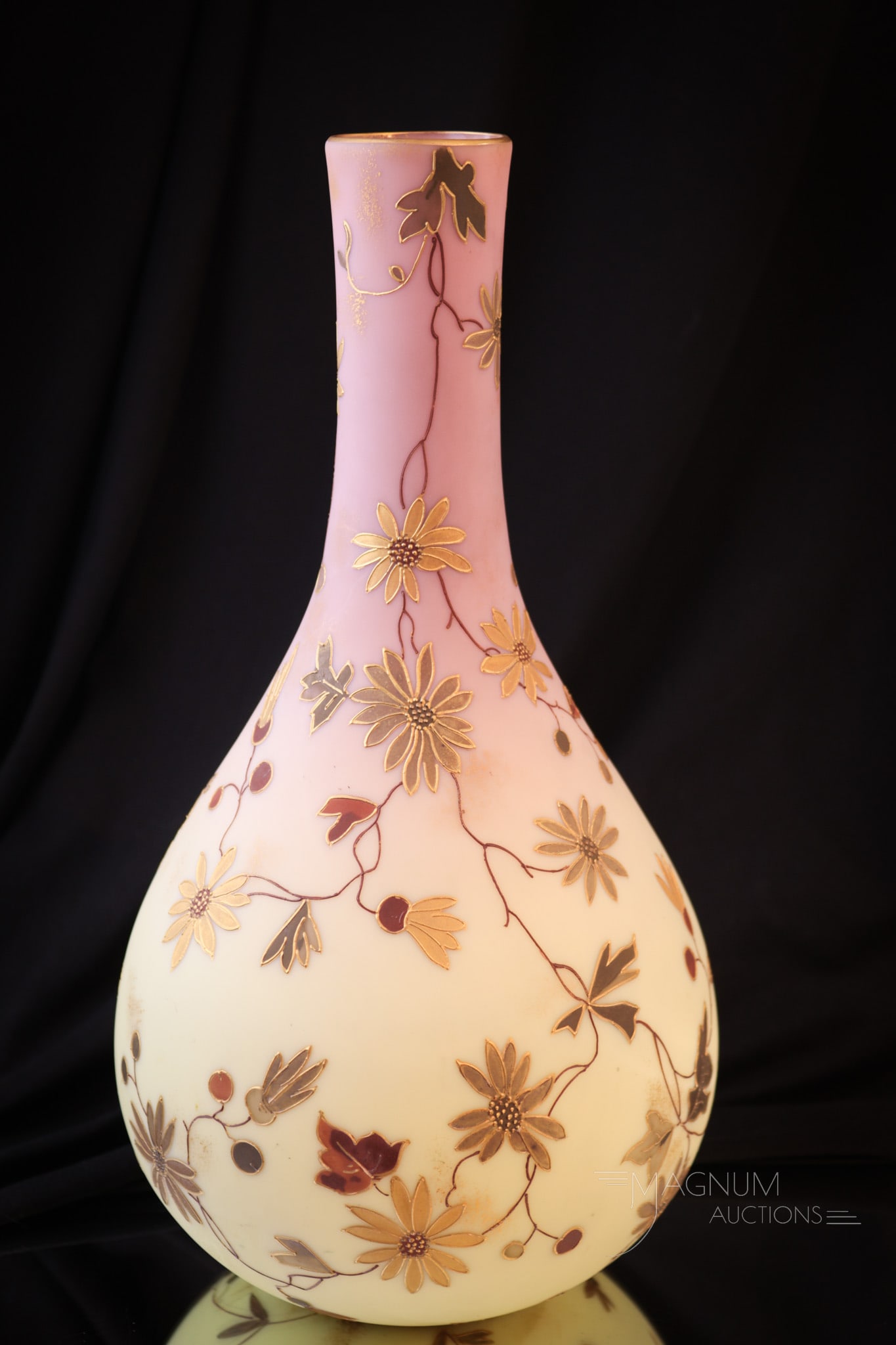 Mt. Washington 12" Burmese Victorian Glass Decorated Vase: This vase is totally decorated from top to bottom and all around. A beautiful find in our line-up of Mt. Washington glass. This burmese beauty measures in at a whopping 12" tall. Provenance: This item