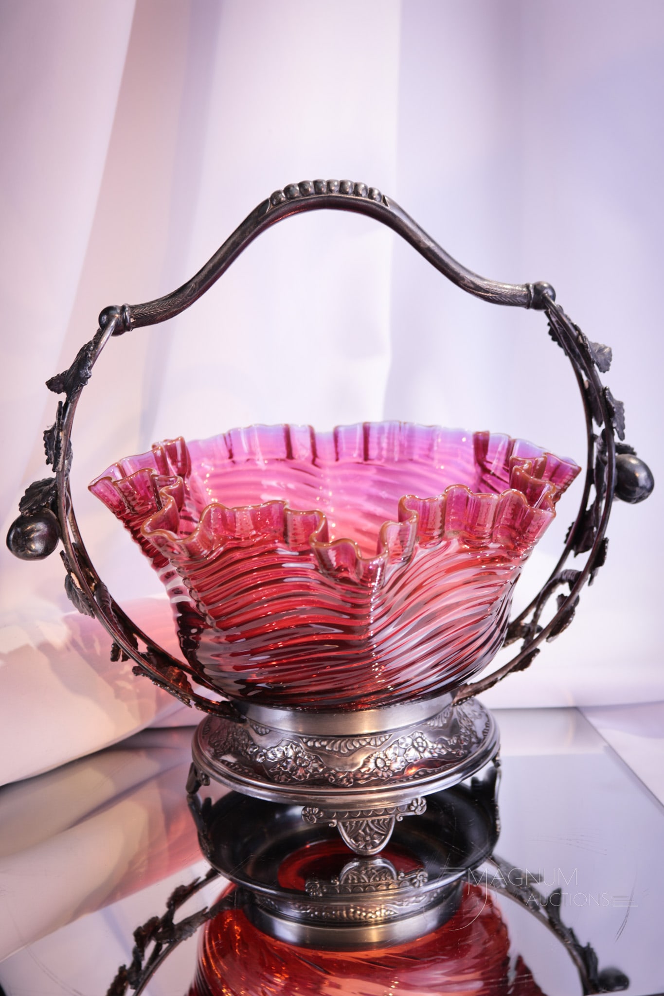Pairpoint Silverplate Mt. Washington Ruby Fuscia Brides Basket Bowl: Beautiful Victorian signed Pairpoint silverplate frame brides basket complete with figural apples and leaves. This fine basket holds a deep ruby to fuscia colored Mt. Washington glass bowl. Complete i