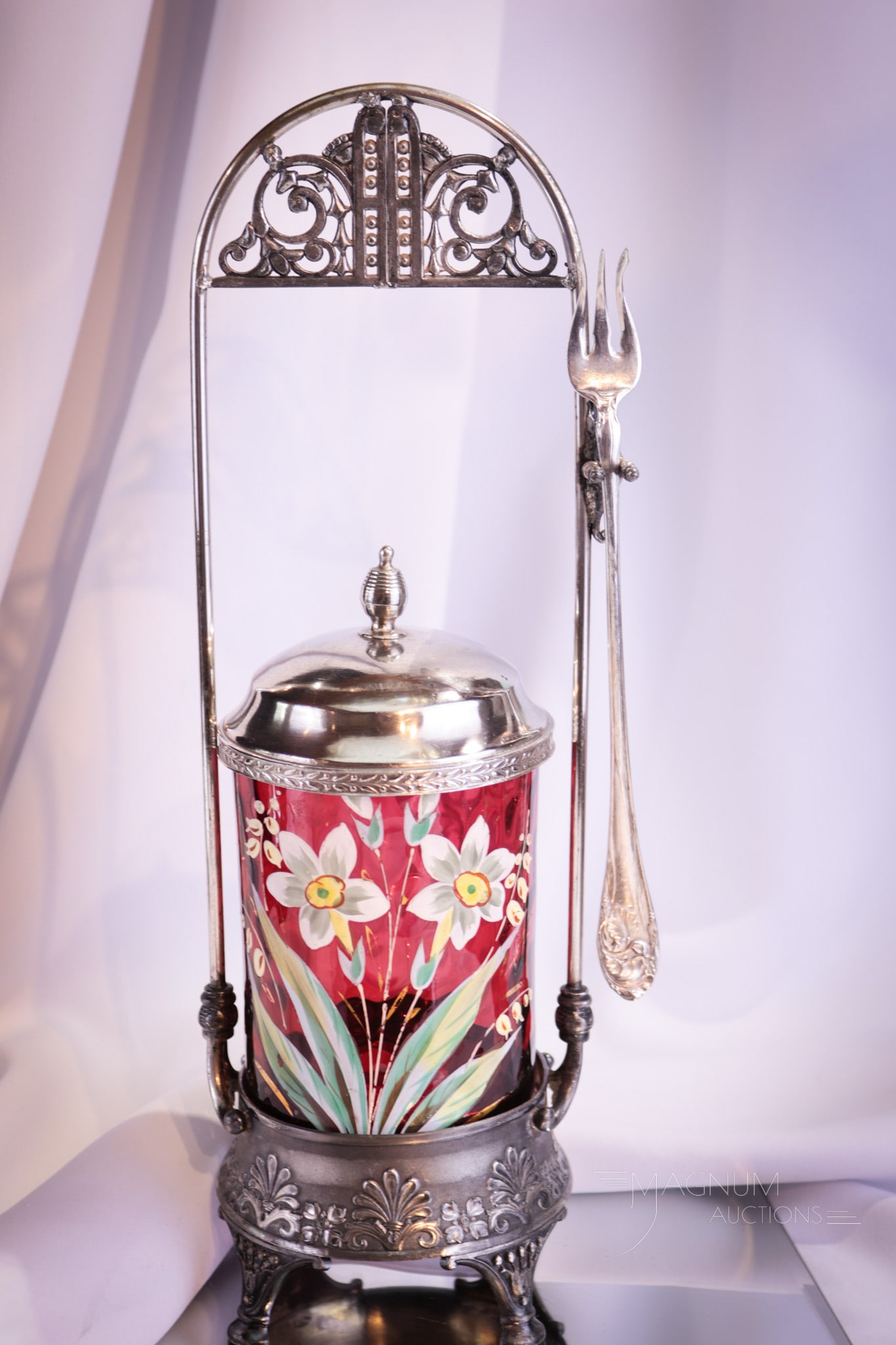 Simpson Hall Miller Victorian Cranberry Enameled Glass Silverplate Pickle Castor: Very attractive Victorian cranberry enameled and gilt decorated pickle jar set in a signed original Simpson Hall and Miller silverplate frame. Castor measures 13 1/2" tall.