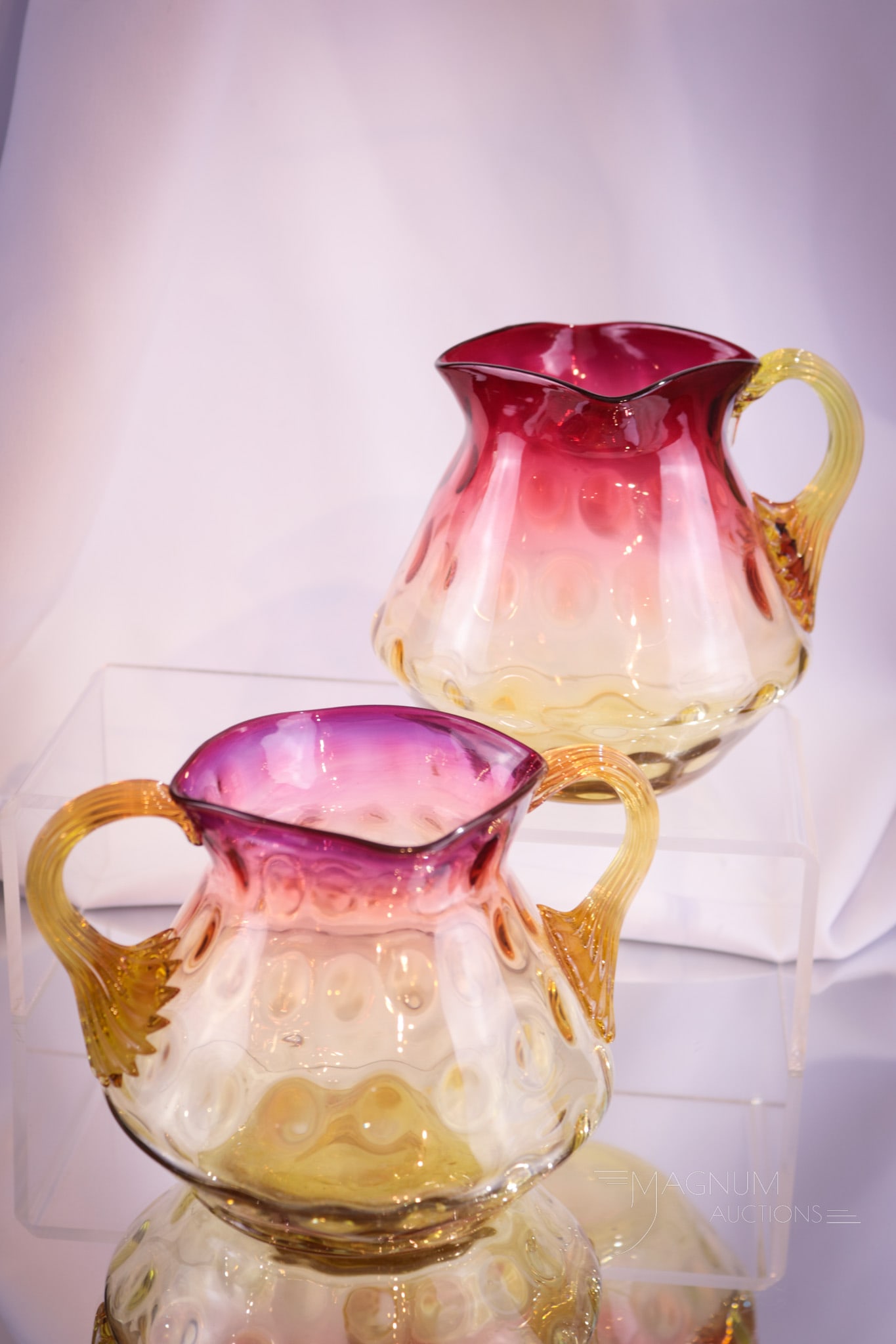 New England Victorian Glass Amberina Creamer & Sugar: Two fine pieces of Victorian amberina glass in this lot. A pairing of a New England creamer and sugar bowl with double handles. Tallest measures 4 3/4".
