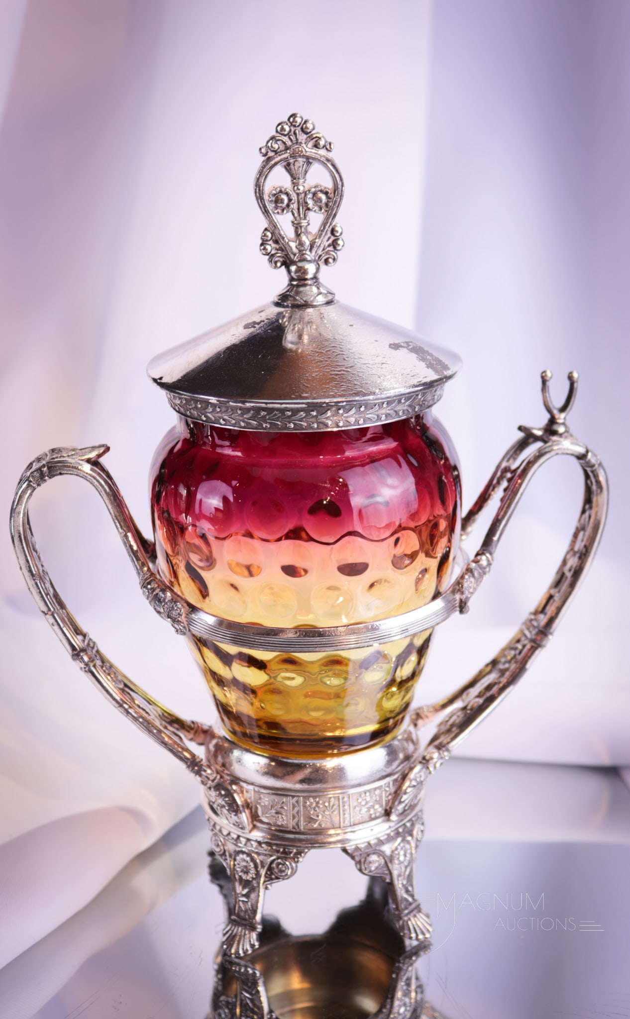 Tufts Silverplate Victorian Amberina Glass Pickle Castor: A fantastic find in our line up of Victorian silverplate and glass. This pickle castor frame is signed Tufts silverplate. The jar is beautiful Victorian amberina glass. Together a wonderful castor. Pi