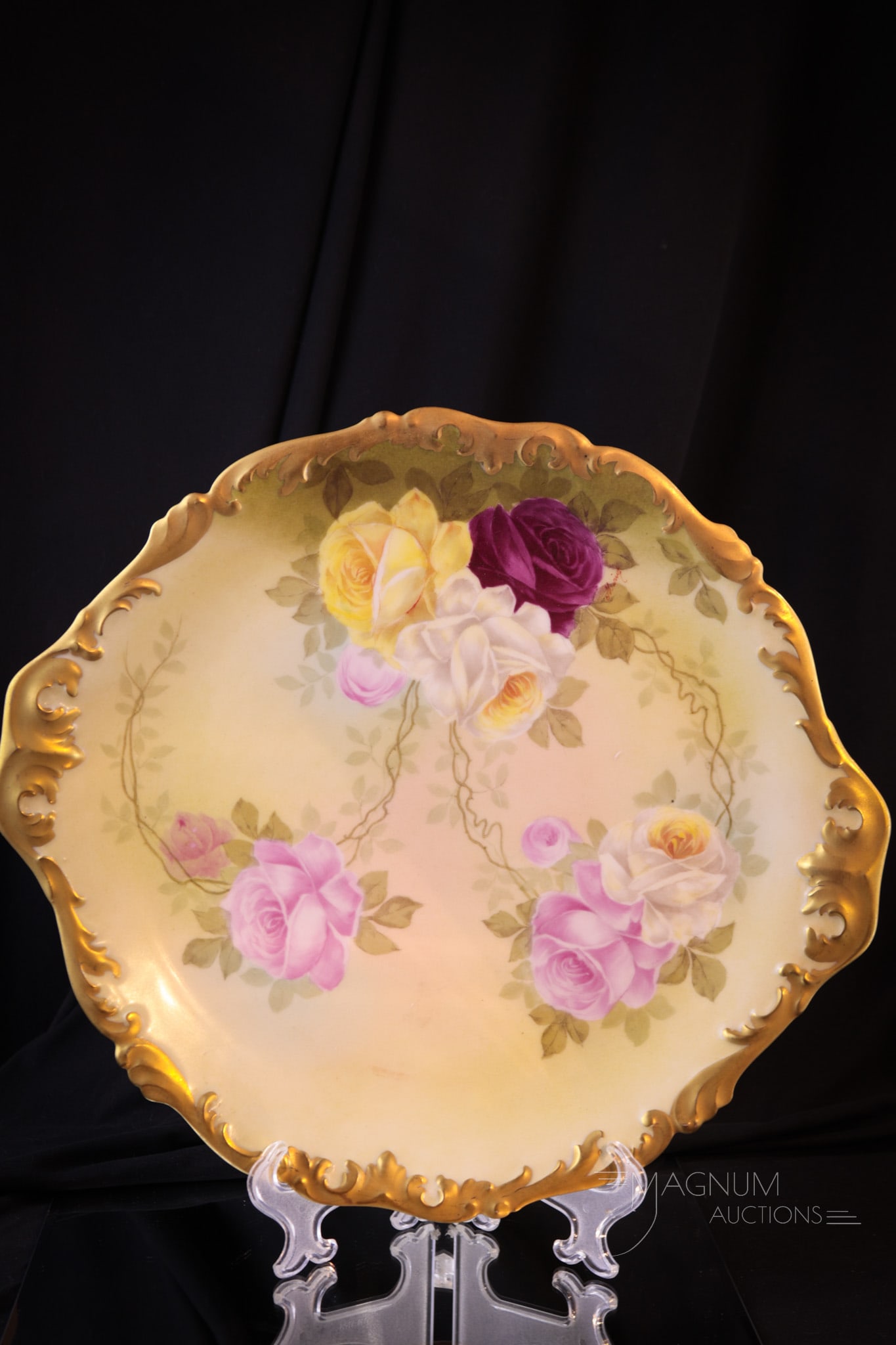 T&V Limoges Hand Painted Porcelain Roses Platter: Signed T & V Limoges, this is a fine offering of a hand painted platter. This piece has an abundance of roses and lots of gold trim. Piece measures 14 3/4" in diameter.
