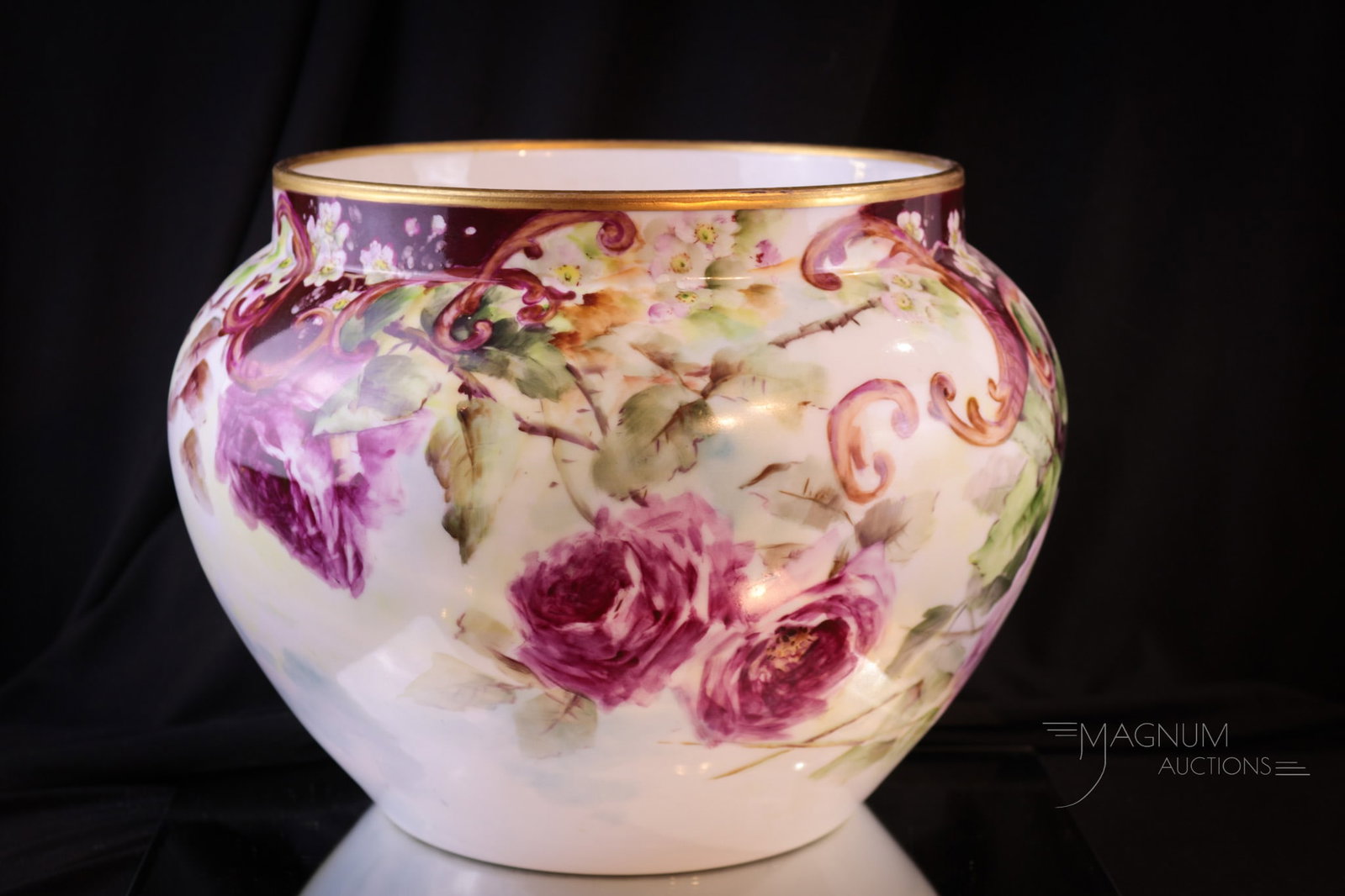 D&G France Hand Painted Roses Porcelain Jardinere: Fine signed D & G France, hand painted porcelain jardinere covered with big beautiful cabbage roses. Lots of gold trim as well. Jardinere measures 8 1/4" tall, 11" in diameter.