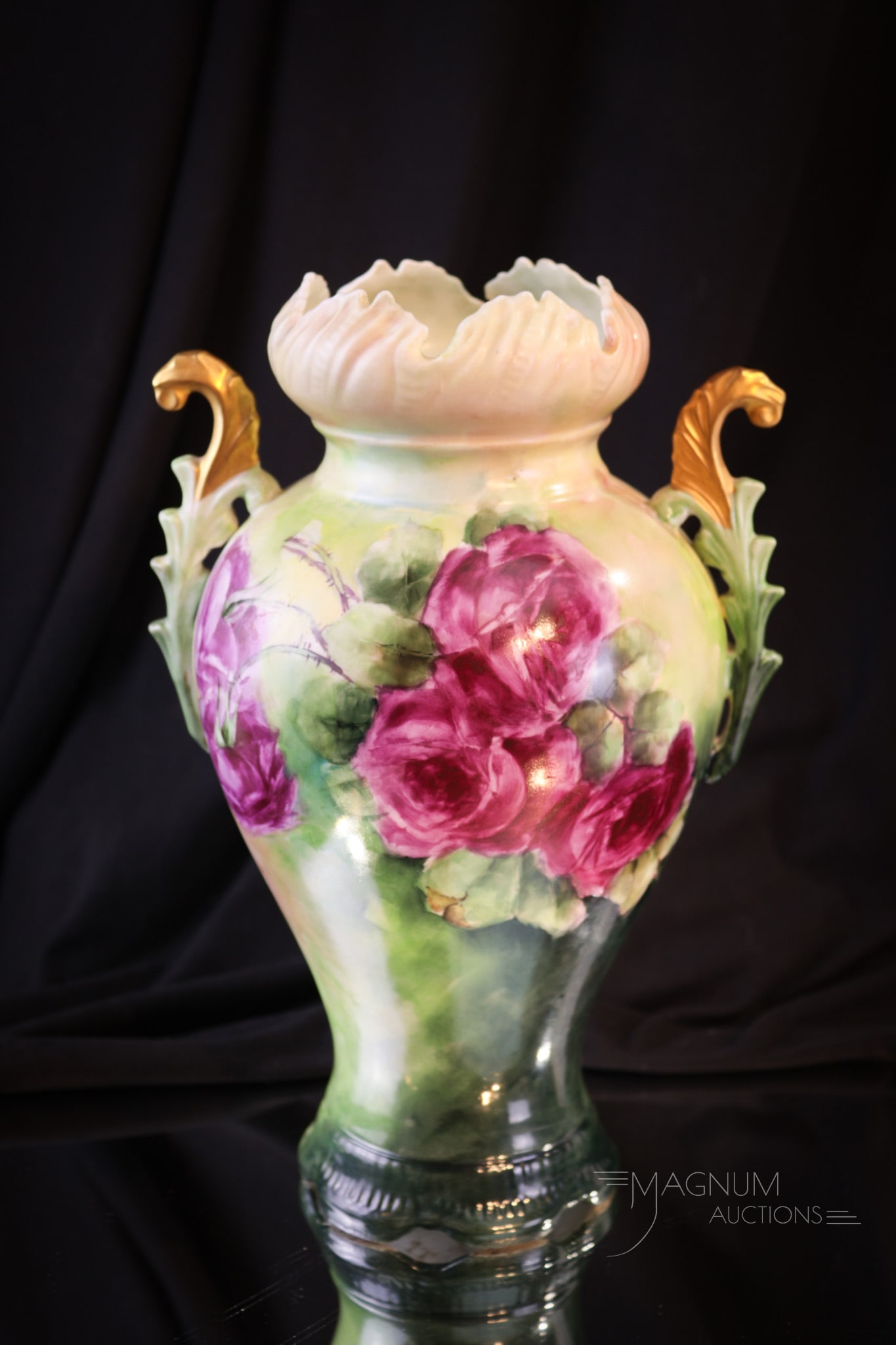 Limoges France Hand Painted Ornate Porcelain Vase: Beautiful form to this marked Limoges France hand painted porcelain vase. This piece has lovely double handles and roses around both sides in pinks and yellows. Vase measures 10 1/2" tall.