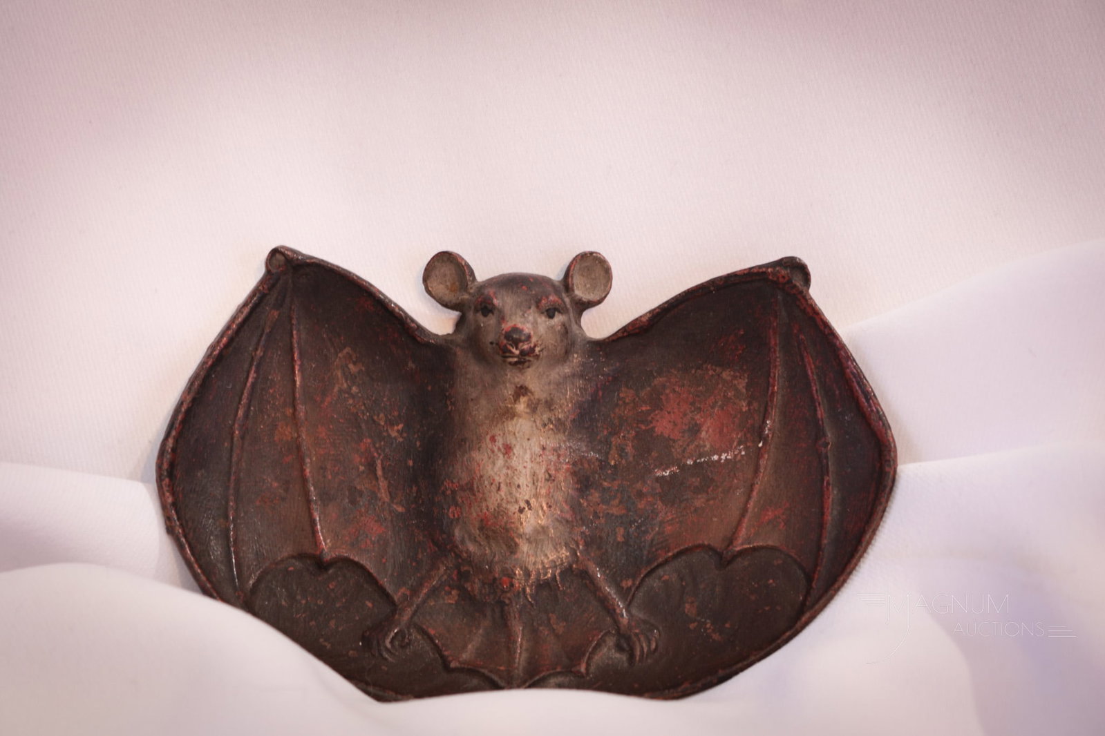 Signed Bradley & Hubbard Cast Iron Bat Tray: Whimsical signed B & H, Bradley and Hubbard cast iron tray in the form of a flying bat. Tray measures 4 1/4" long.