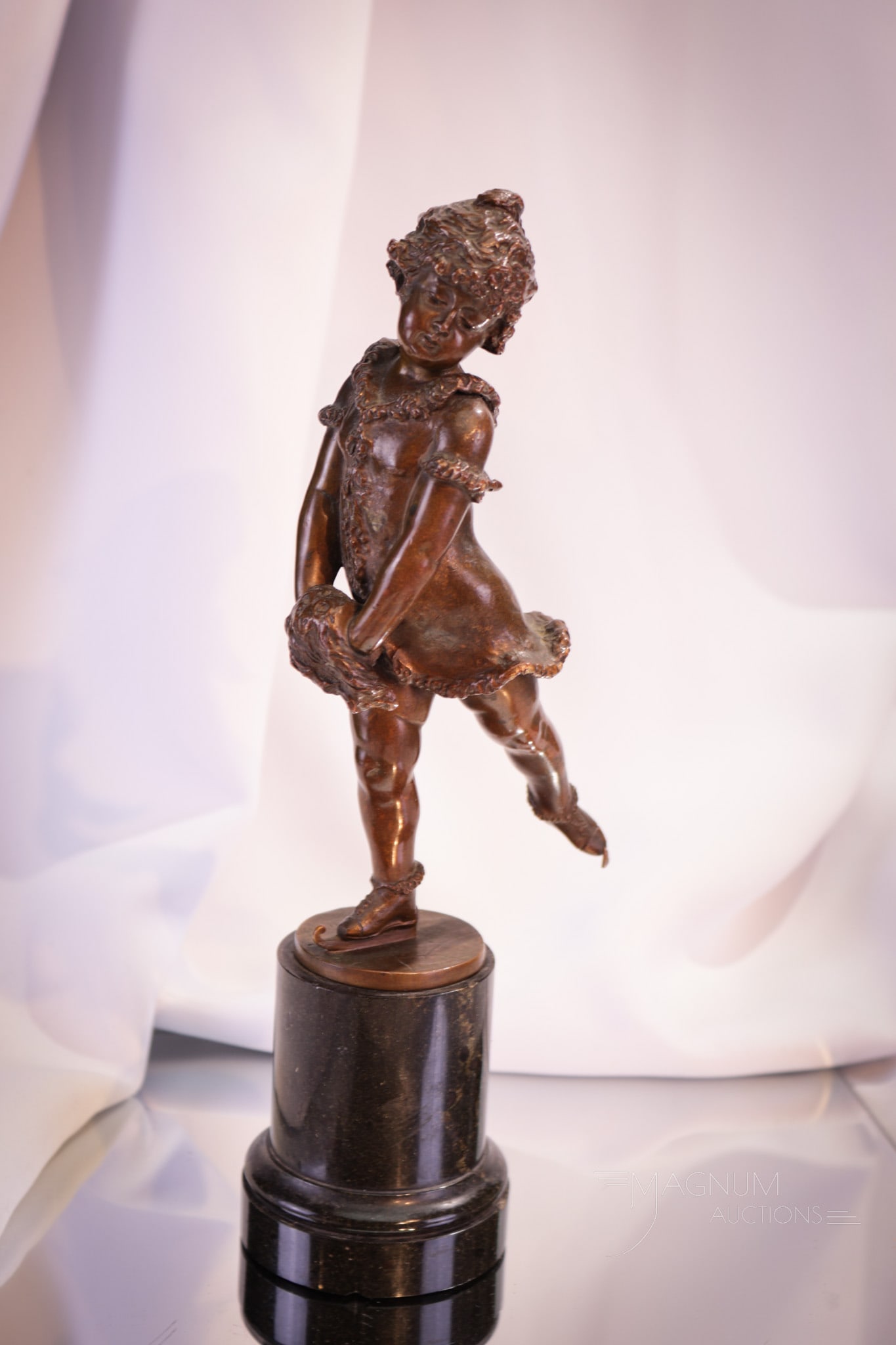 Franz Iffland Ice Skater Girl with Muff Bronze on Marble: Fine signed Franz Iffland, (Berlin, 1862-1935) bronze of an ice skating young girl with muff. This bronze sits on top of a green marble base. Measures 10 1/2".
