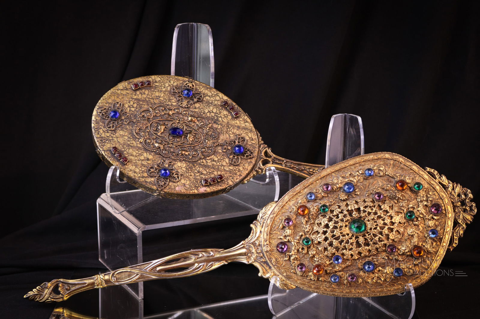 2 pc Lot Austrian Antique Art Deco Jeweled Vanity Hand Mirrors: Two fine examples of Austrian jeweled Art Deco vanity hand mirrors. Each unique in size and decoration. Largest measures 15 1/4".