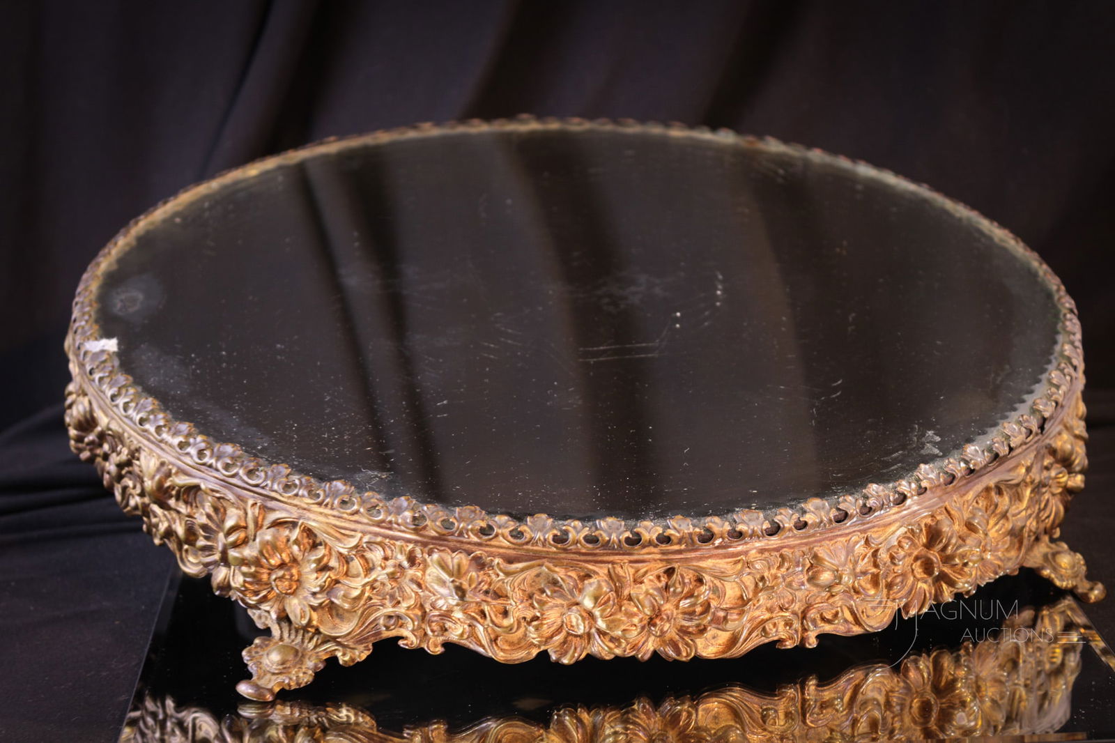 14" Victorian Floral Embossed Beveled Plateau Mirror: Beautiful floral embossed Victorian plateau mirror. This fine piece is sure to showcase your "something special" item. This measures 2 1/2" tall, 14 1/2" in diameter.