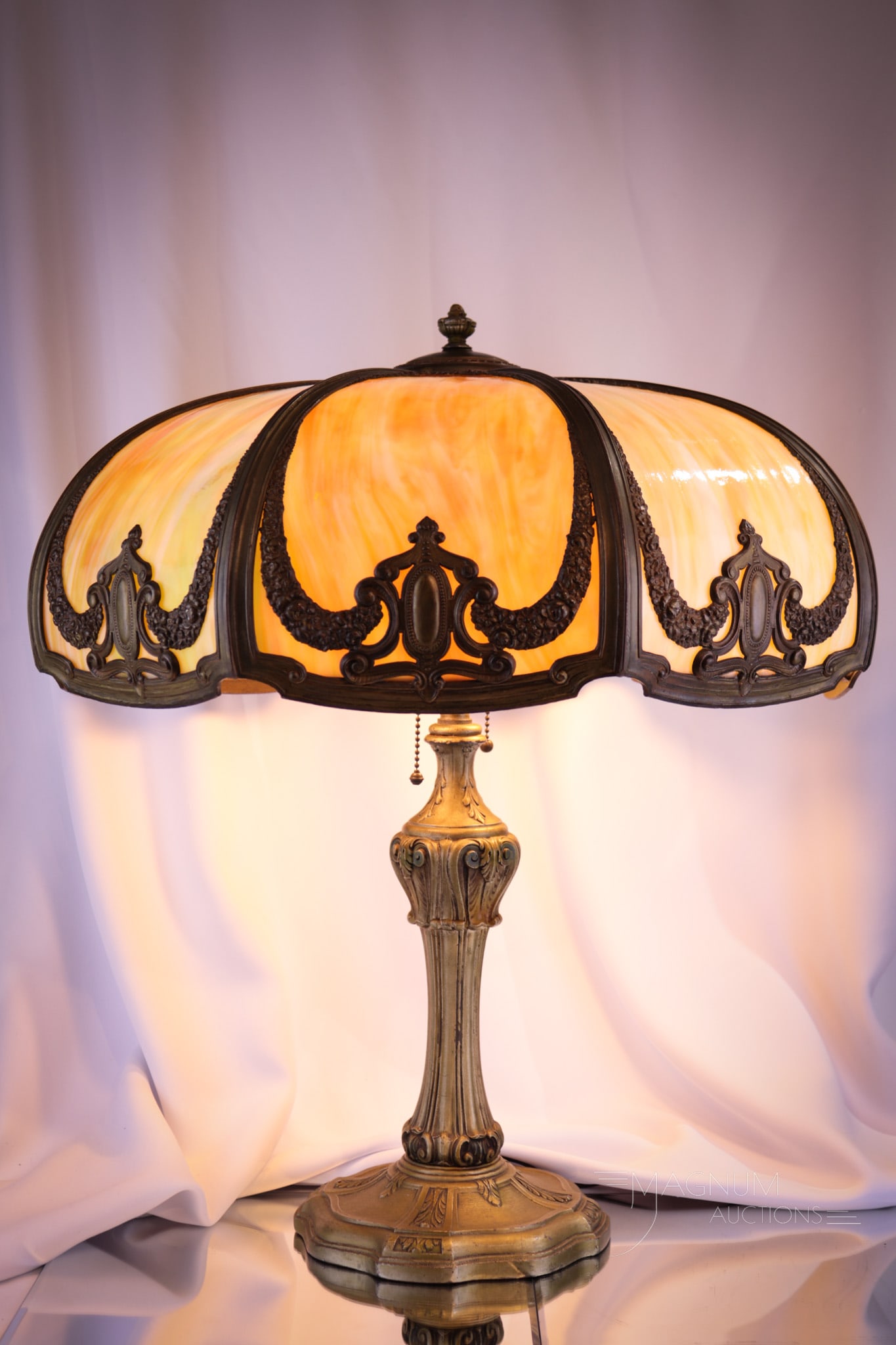 Antique Bent Panel Filigree Slag Glass Table Lamp: Beautiful antique bent panel slag glass table lamp. This lamp with curved slag panels and filigree overlay. Complete on ornate base. Lamp features original patina and gorgeous design. Lamp measures 23