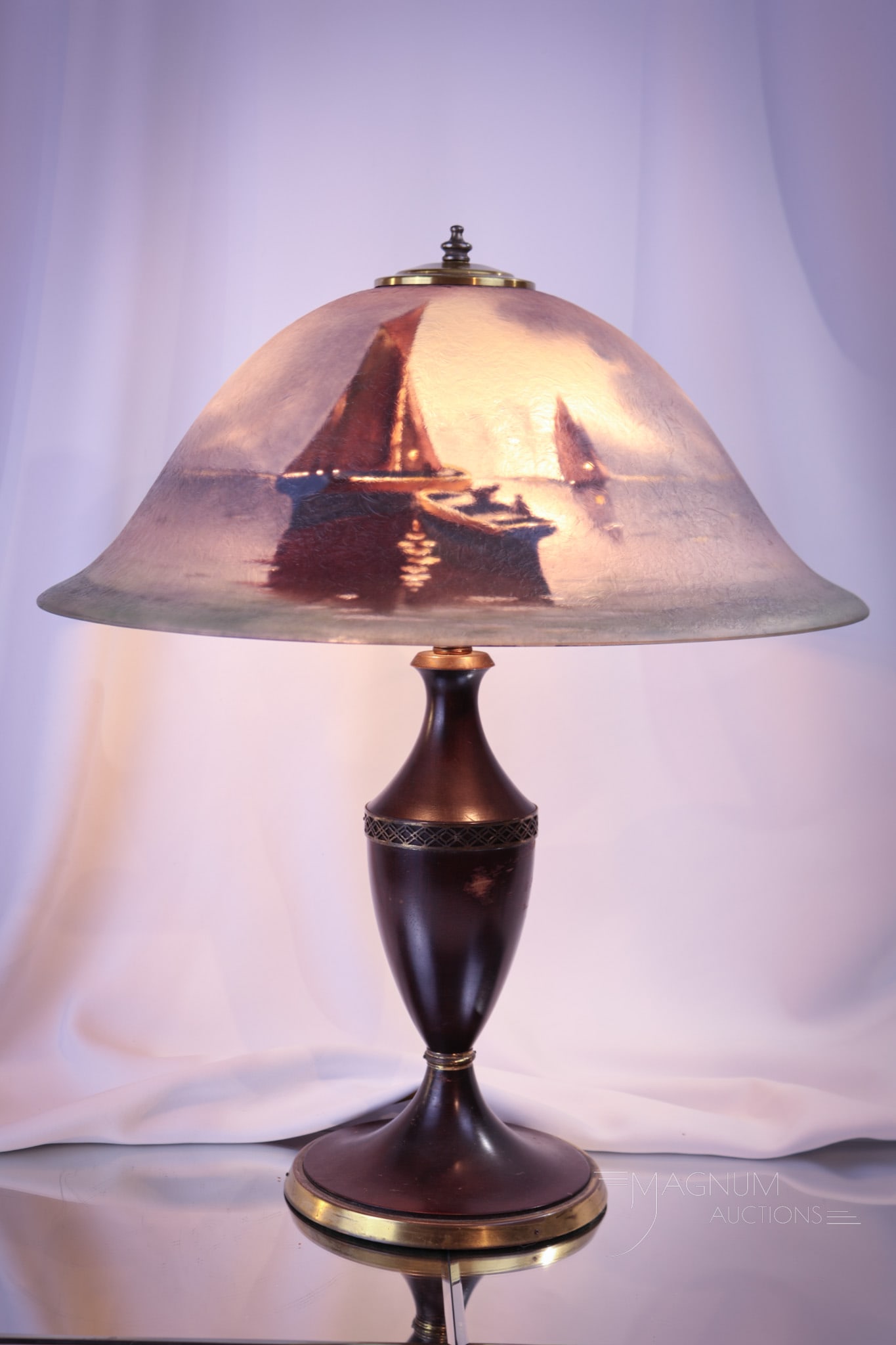 Pairpoint Reverse Painted Sailing Ship Table Lamp: A fine Pairpoint reverse painted table lamp. Lamp features a chipped ice-textured shade with ships sailing in the night. Shade is signed, "C. Durand." Shade is 17" in diameter. Base is original Pairpo