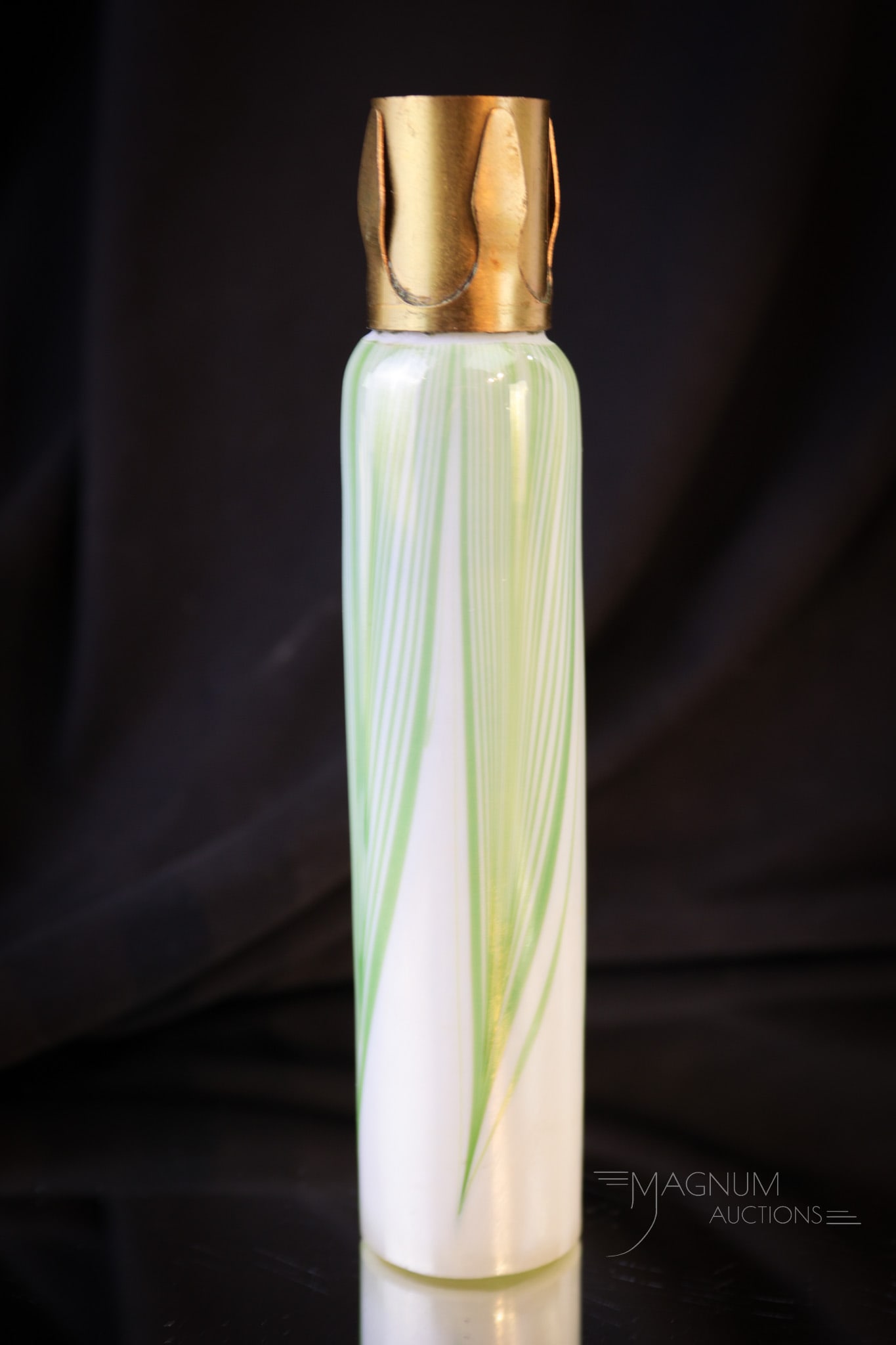 Tiffany Studios Pulled Feather Candle Lamp insert: Fine Tiffany Studios pulled feather candle lamp insert. This pulled feather piece is a hard to come by item to complete your candle lamp. Measures 5 5/8" long. Minor as-made nick to top rim.