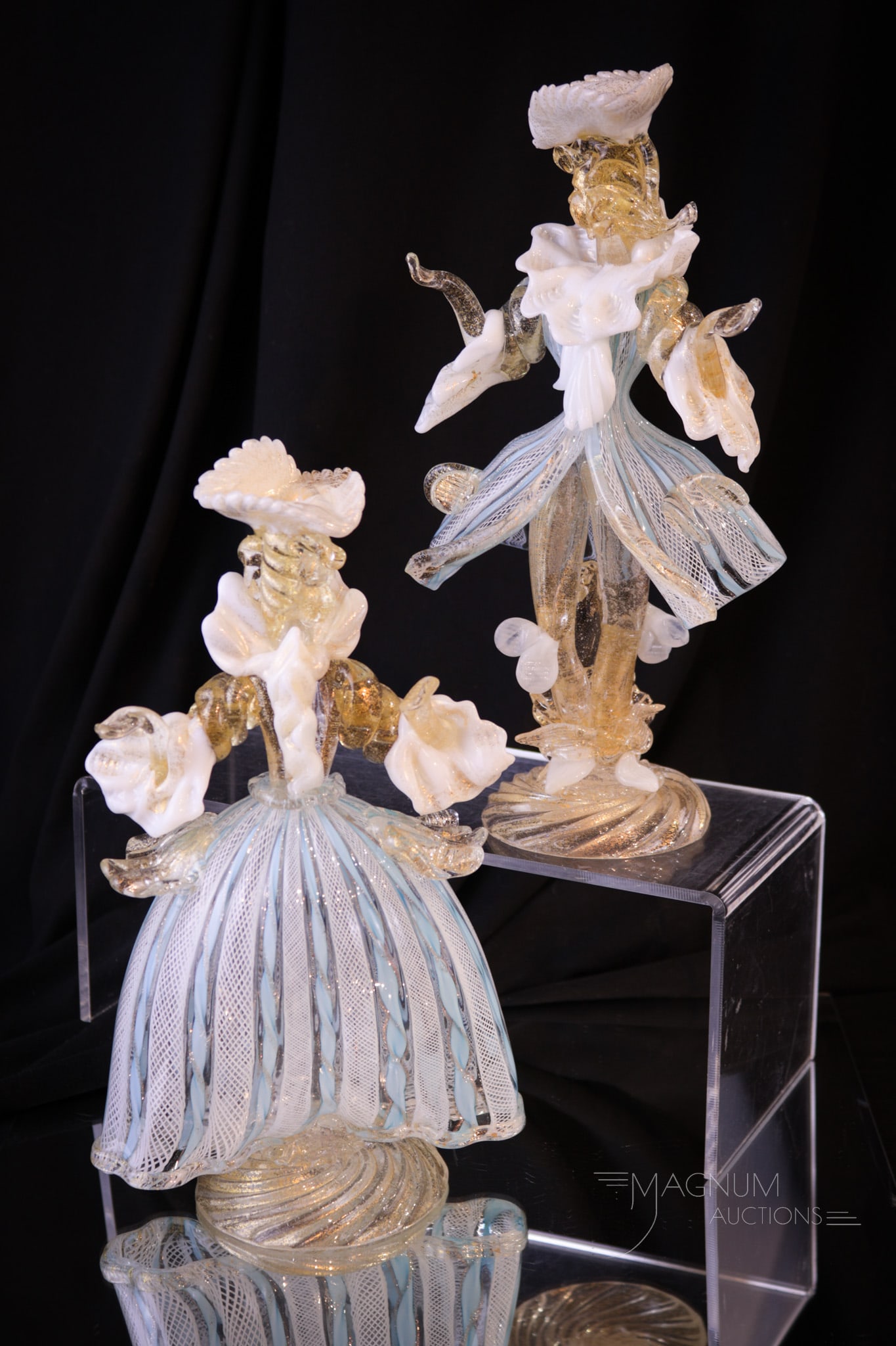Pair Italian Murano Latticino Art Glass Figurines: Pair of Italian Murano Latticino art glass figurines in the form of male and female. Each with gold flakes and latticino garments. Tallest measures 9 3/4" tall.