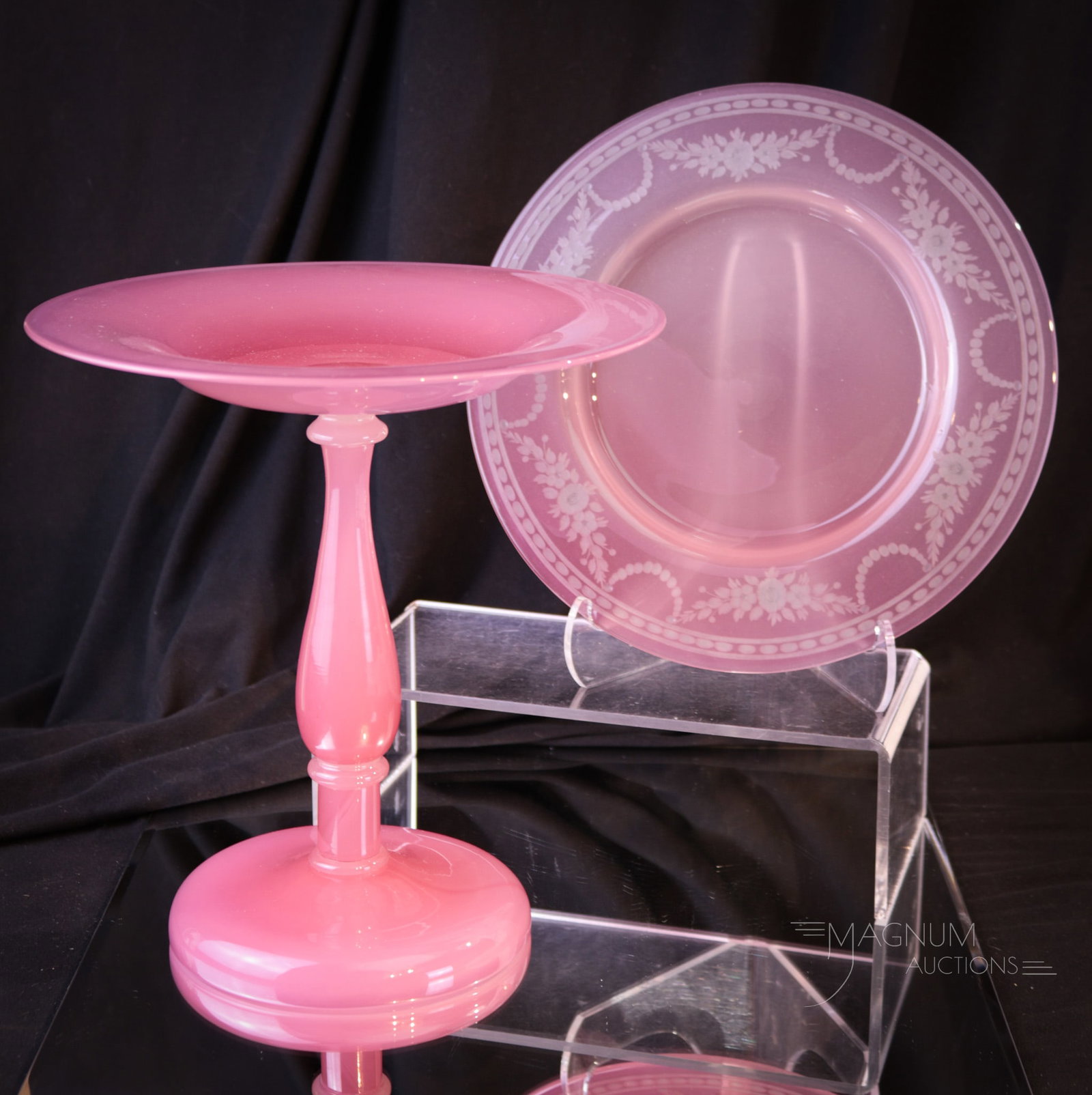 2 pc Lot Steuben Rosalene Alabaster Art Glass Compote & Plate: Two nice finds in Steuben Rosalene art glass. The first is a compote with Alabaster connectors. The second is a plate with acid cut-back decoration. Compote measures 8 1/2" tall, 8" wide. The plate me