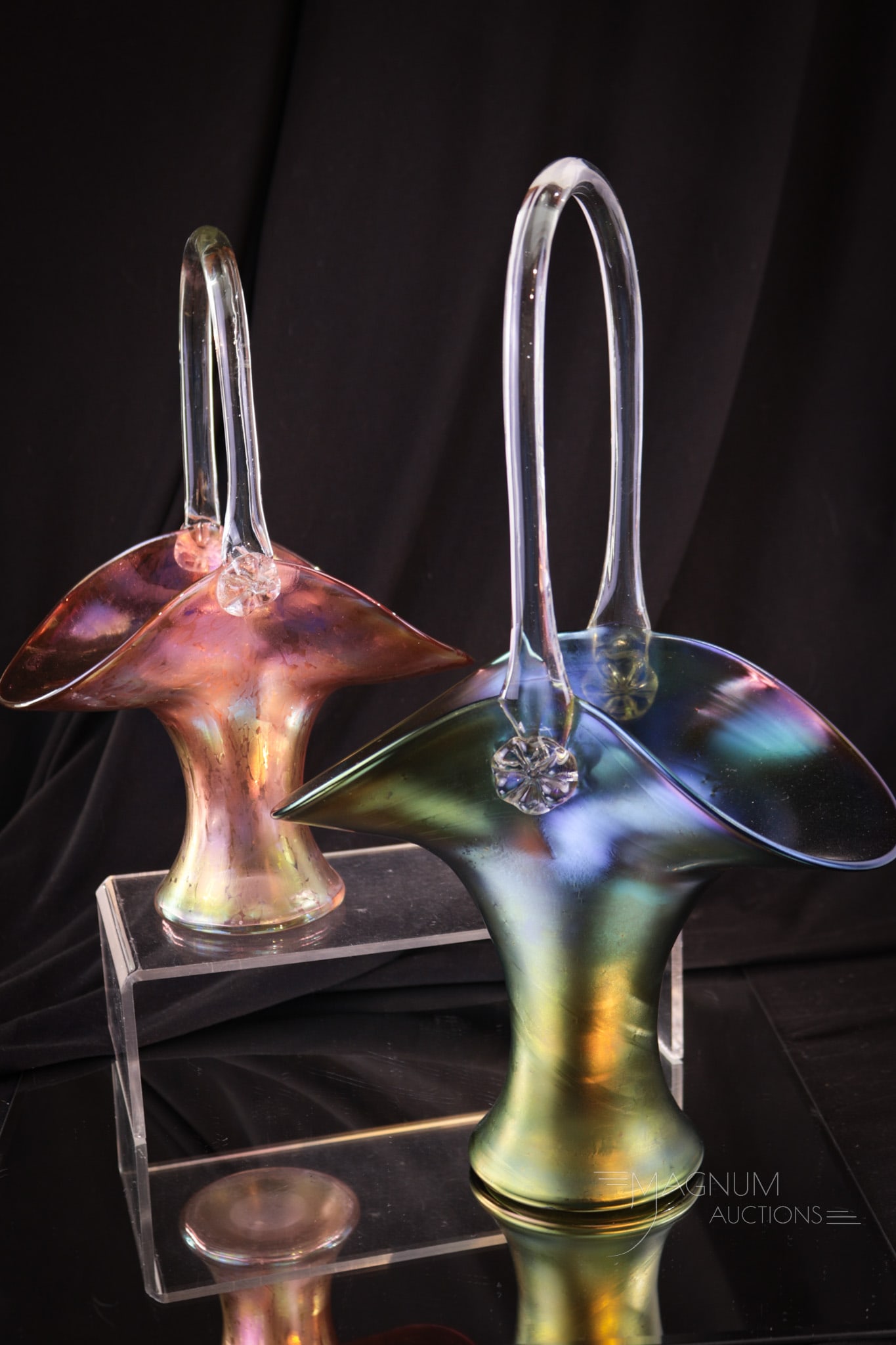 2 pc Lot Austrian Iridescent Art Glass Baskets: Two beautiful and unique colored examples of art glass baskets. One green and one pink color with slight oil spot iridescence. Tallest measures 13"