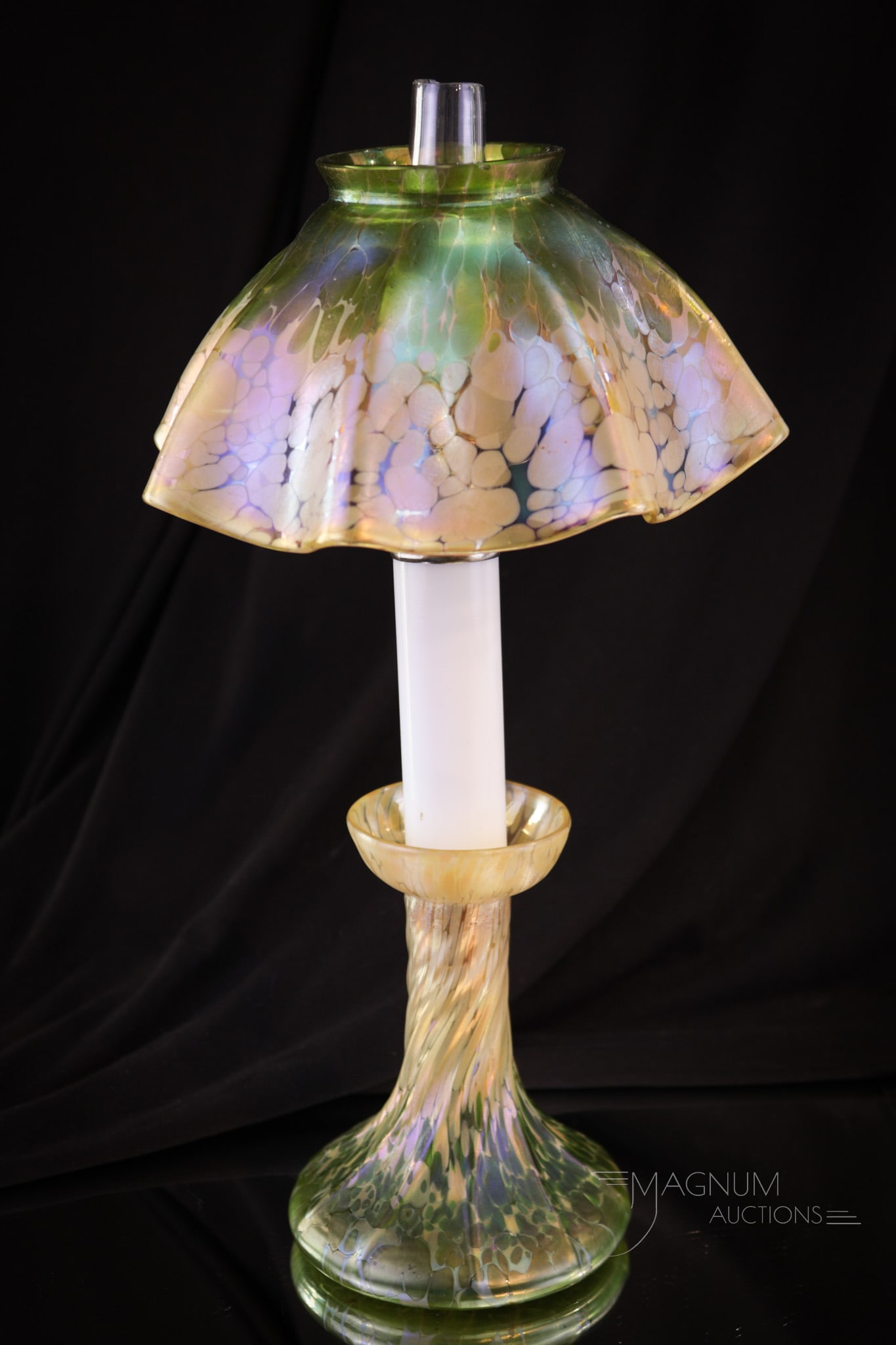 Loetz Phaenomen Art Glass Candlestick Lamp: Loetz Phaenomen art glass candlestick lamp. This one with vibrant coloring and wonderful irridescence. Lamp measures 12 1/2" tall.
