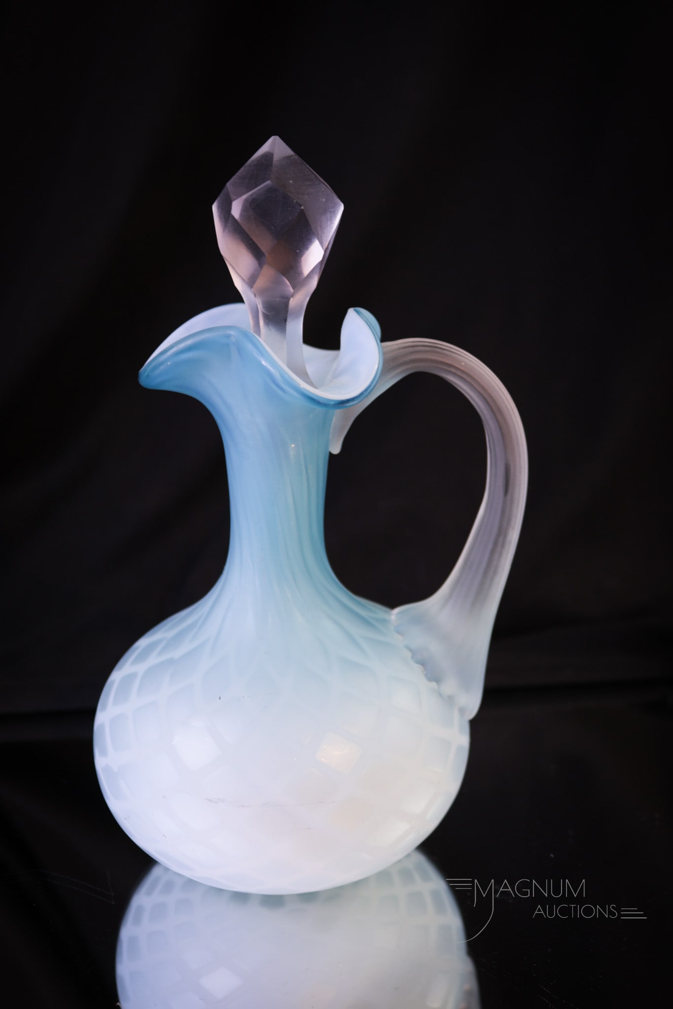 Diamond Quilt Phoenix Glass Mother of Pearl Victorian Cruet: Heavenly blue Victorian glass mother of pearl satin glass cruet in a diamond quilt pattern. This fine cruet in sleek form retains the cut faceted stopper. Beautiful find! Measures 7" tall.