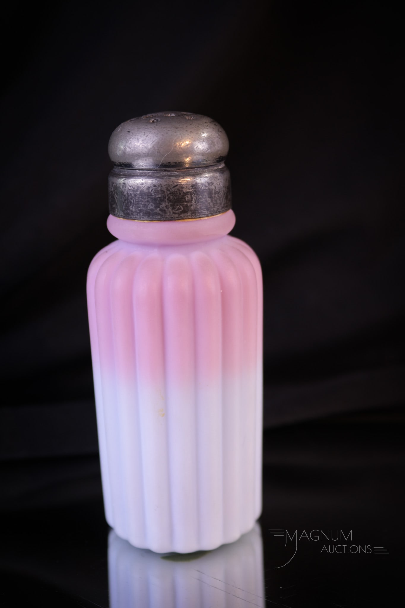 Rare Mt. Washington Peachblow Victorian Glass Salt Shaker: Another fine and Rare example of beautiful Mt. Washington peachblow Victorian glass in the form of a ribbed salt shaker. This shaker is complete with two-piece metal top. Piece measures 4" tall.