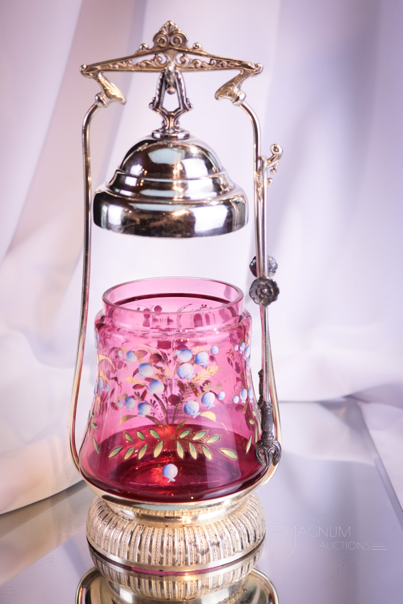 Rockford Victorian Silverplate Cranberry Gilt Enameled Pickle Castor: A super pickle castor folks! This one complete with hanging lid and lovely gilt enameled cranberry jar. Frame is signed Rockford silverplate. Complete this fine castor measures 11" tall.