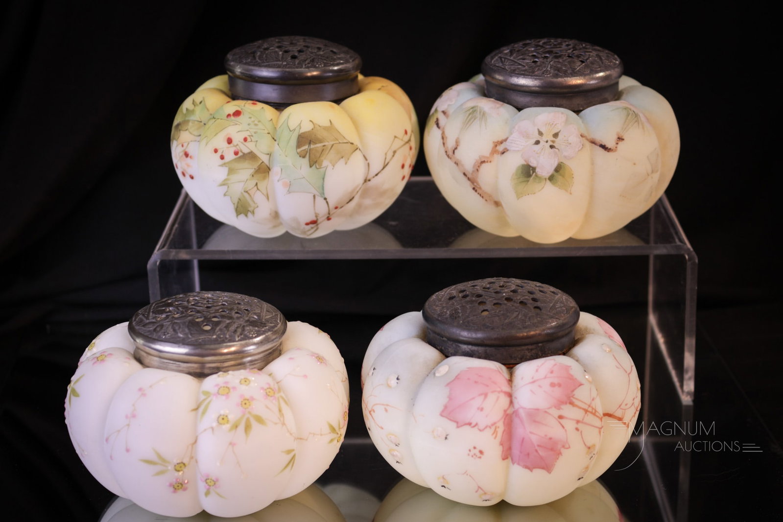 4 pc Lot Victorian Mt. Washington Tomato Sugar Shakers: Four select examples of Victorian Mt. Washington glass sugar shakers in various decoration and colorings. Each measures 2 1/2" tall.