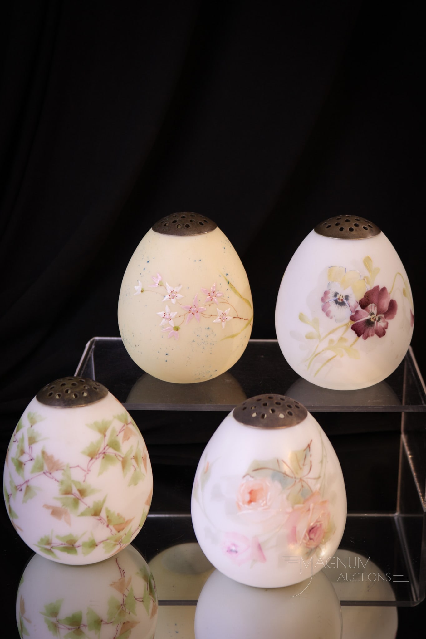 4 pc Lot Victorian Mt. Washington Glass Ostrich Egg Sugar Shakers: Four selections in Mt. Washington Ostrich egg sugar shakers that are sure to please. Each with lovely florals around the body. Imagine the possibilities! Each measures 3 3/4" tall.