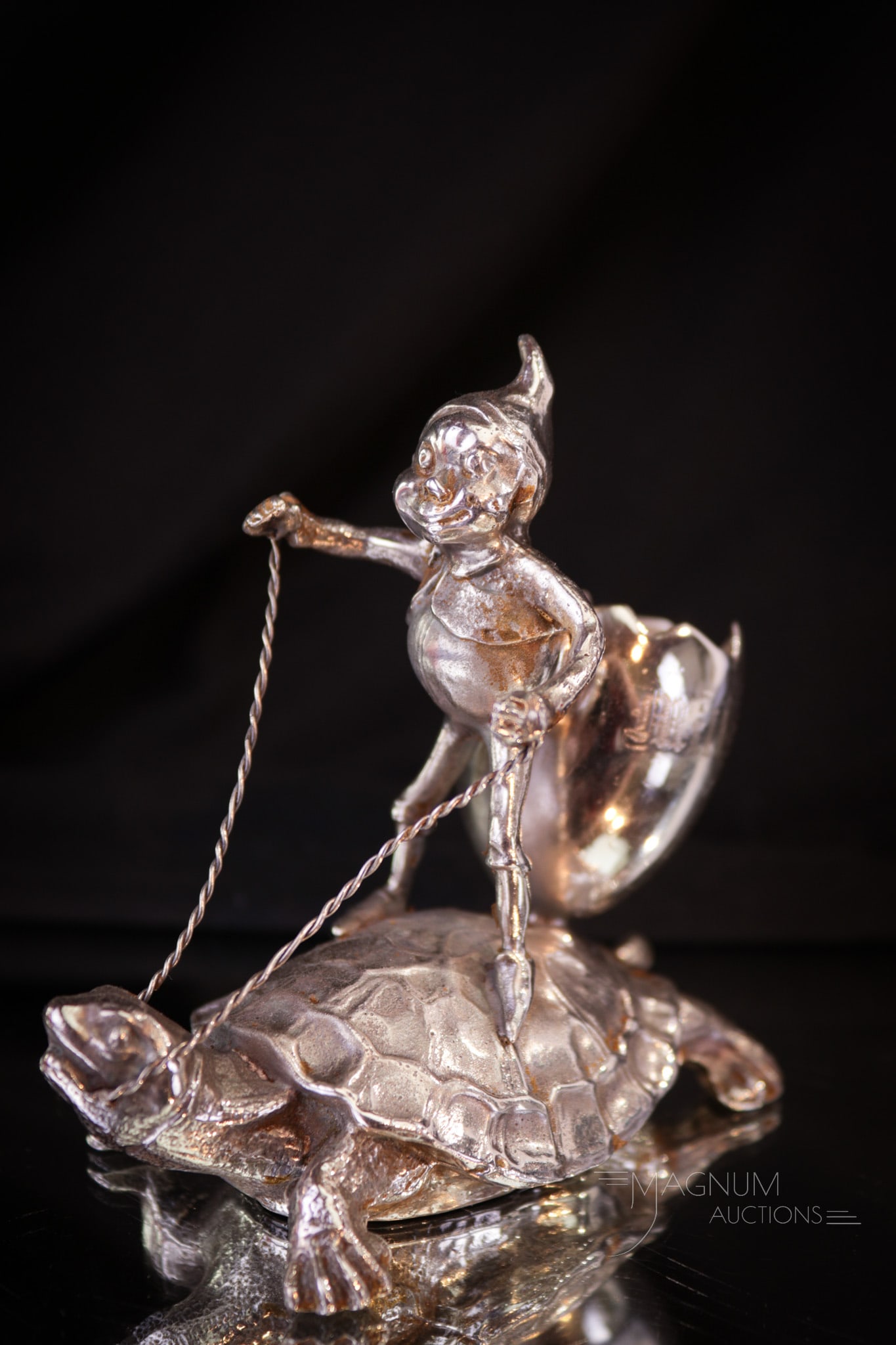 Pairpoint Silverplate Victorian Toothpick Holder Brownie on Turtleback: How charming is this little signed Pairpoint silverplate Victorian toothpick holder? We think very! This one is a figural Palmer Cox Brownie on the back of a turtle. Measures 3 1/2" tall. Provenance: