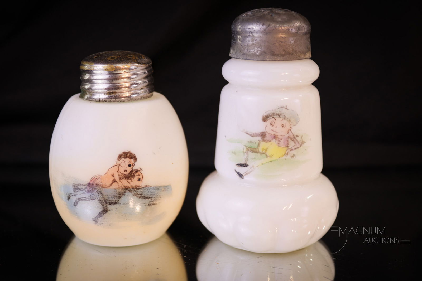 2 pc Lot Victorian Glass Palmer Cox Brownie Salt Shakers: Two unique form finds in Victorian opal glass salt shakers. Both with Palmer Cox Brownies on them. What are those little Brownies doing you ask? They'll never tell. Tallest measures 3 1/4".