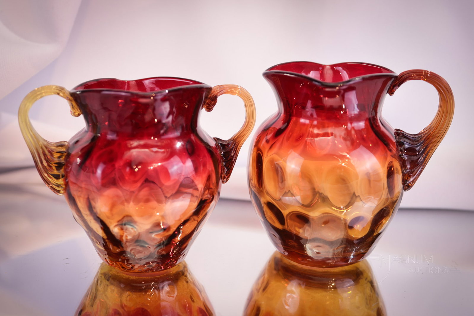 2 pc Lot Victorian 2 7/8" Amberina Glass Creamer & Sugar: Two superb finds in Victorian amberina glass. This tiny little pairing is sure to please. Tallest of the pair measures 2 7/8" tall. The double handle sugar is sometimes collected as a toothpick holder