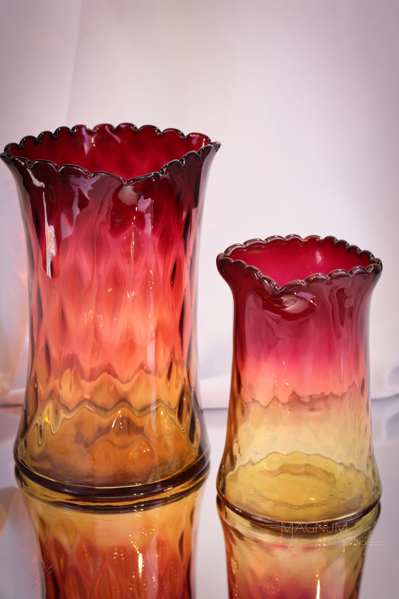 2 pc Lot Victorian Amberina Glass Celery & Spooner: Two luxurious finds in Victorian amberina diamond quilt glass. This lot is comprised by a celery vase along with a spooner. Tallest measures 6 1/2".