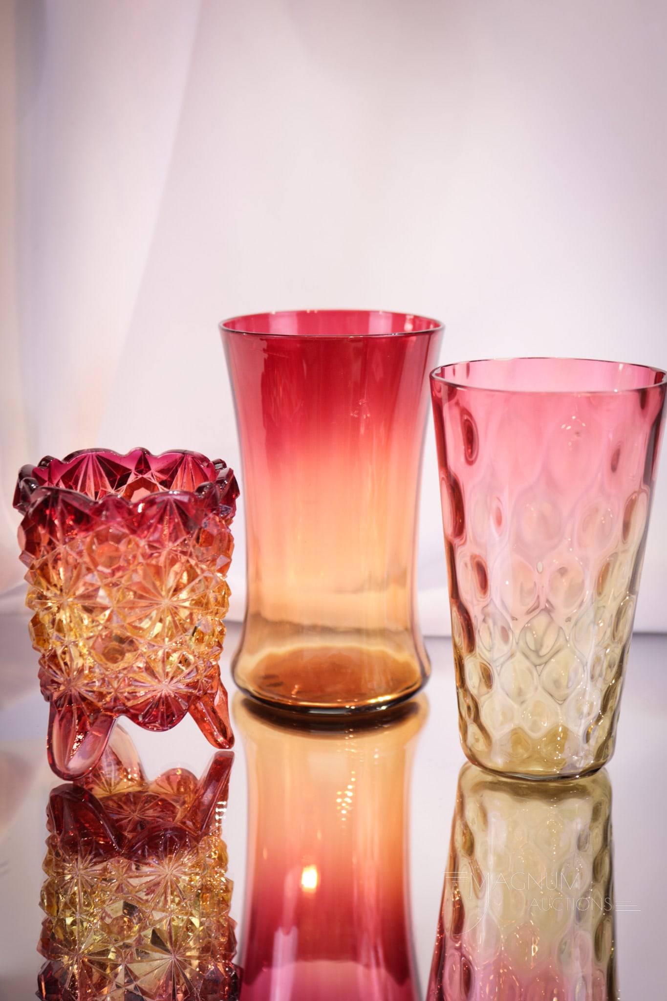 3 pc Lot Victorian Amberina Glass Hobb's & More: Three nice examples of Victorian amberina glass in this lot. Featured is two unique optic pattern juice glasses along with an amberina Hobb's Daisy & Button pattern toothpick holder. Tallest measures