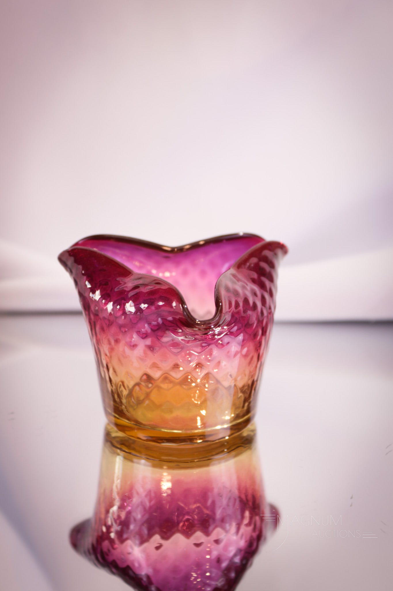 Amberina Victorian Diamond Quilt Tri-Corner Toothpick Holder: Perfect form and coloring makes up this gem of a Victorian toothpick holder. This fine piece has diamond quilt optic pattern to the glass. Measures 2" tall.