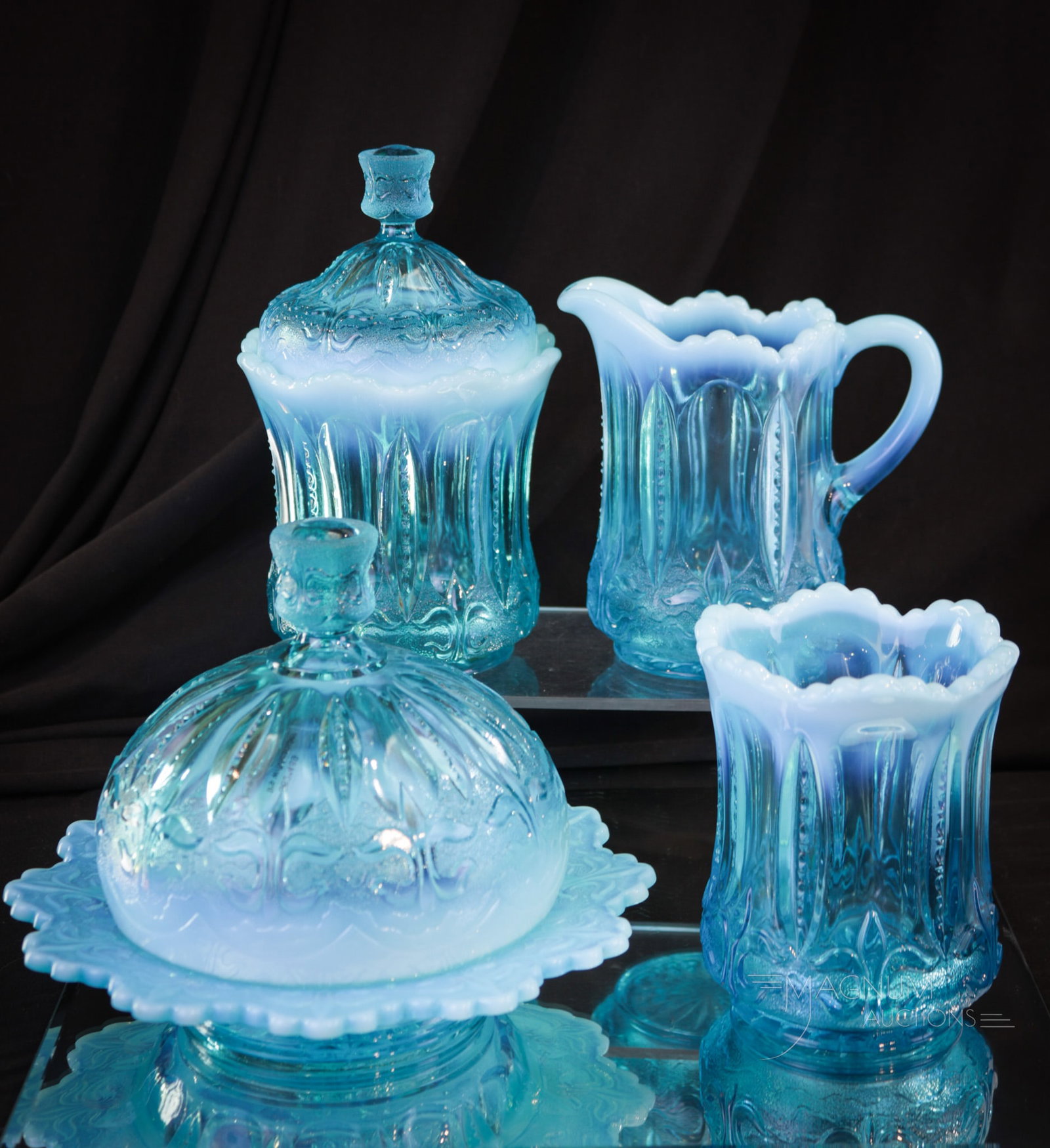 4 pc Jefferson Glass Blue Opalescent Iris with Meander Table Set: Striking example of a beautiful Victorian blue opalescent glass table set in the Jefferson Iris with Meander pattern. Each piece with brilliant blue opalescent coloring. Tallest measures 7 1/4".