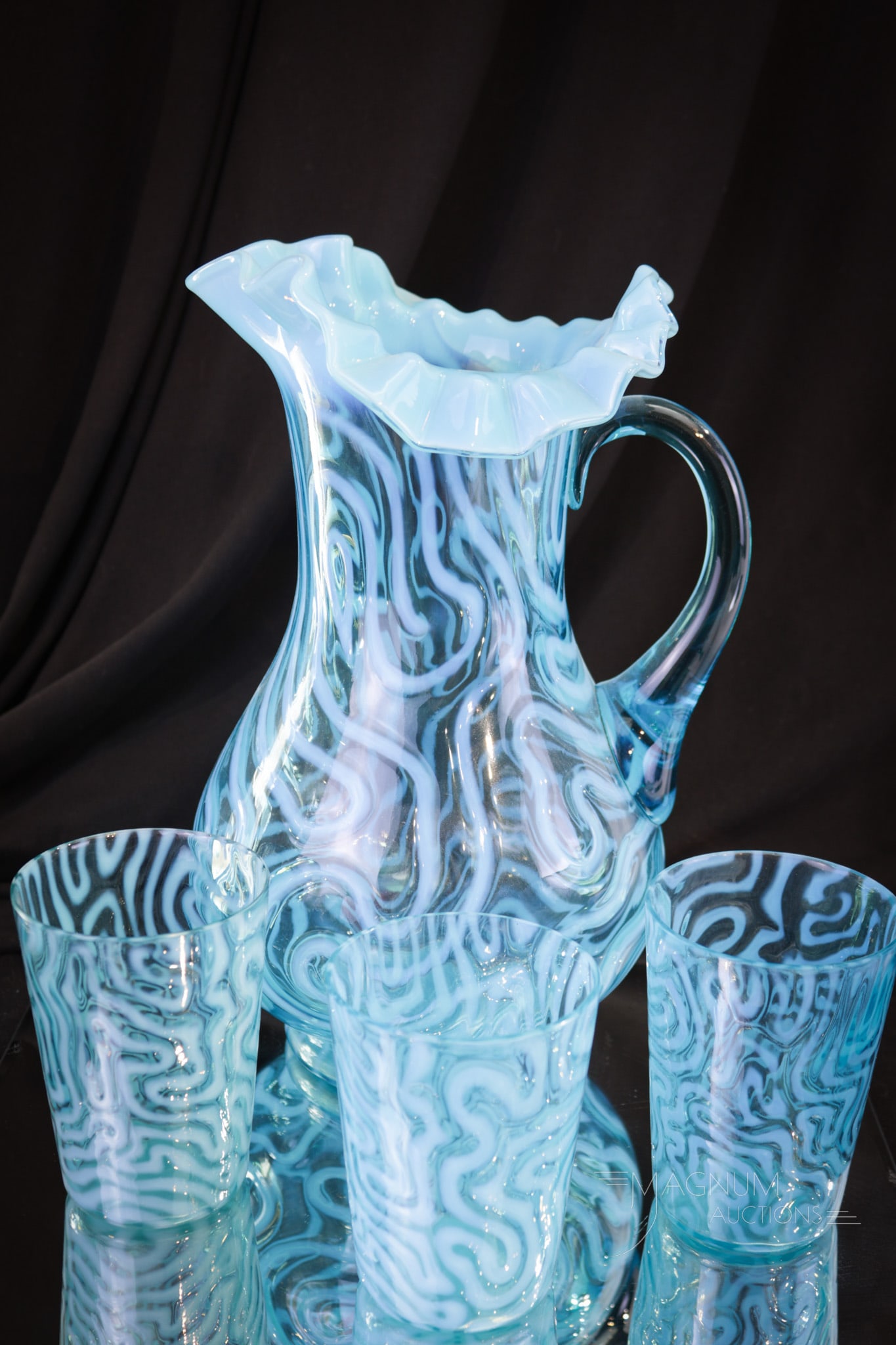 4 pc Blue Opalescent Swirling Maze Victorian Glass Water Set: A rare set if we do say so ourselves! This fine water set is in the Jefferson Swirling Maze pattern. This set is complete with three tumblers and a pitcher. Tallest measures 11" tall.