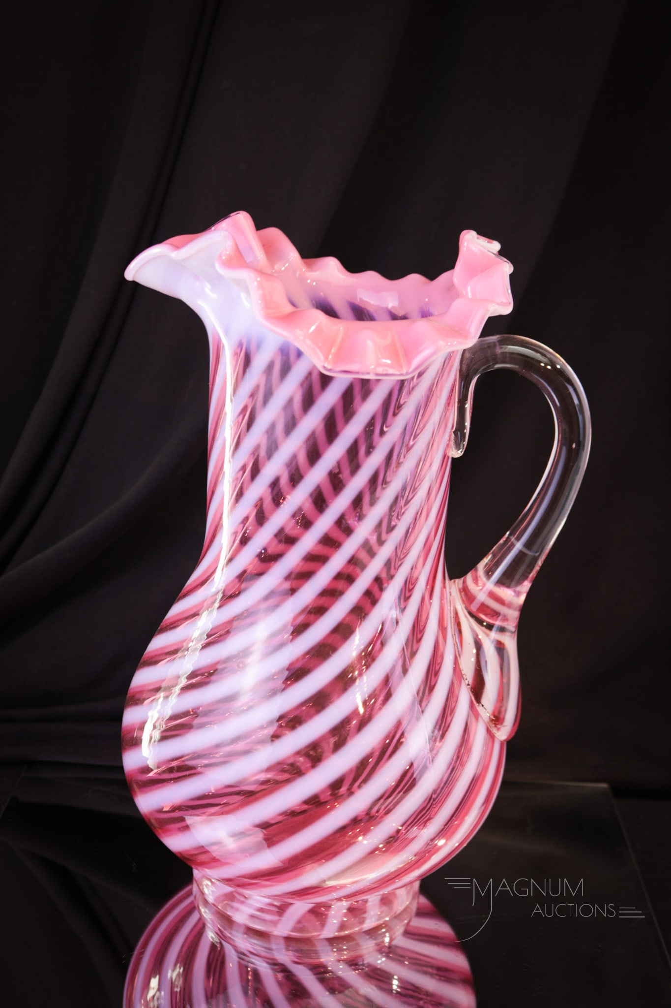 Cranberry Opalescent Jefferson Victorian Glass Tankard Pitcher: A strong example of a beautiful Jefferson glass cranberry opalescent water pitcher. This tankard is in the swirl pattern. Nice ruffled top rim and tall at 11" high.