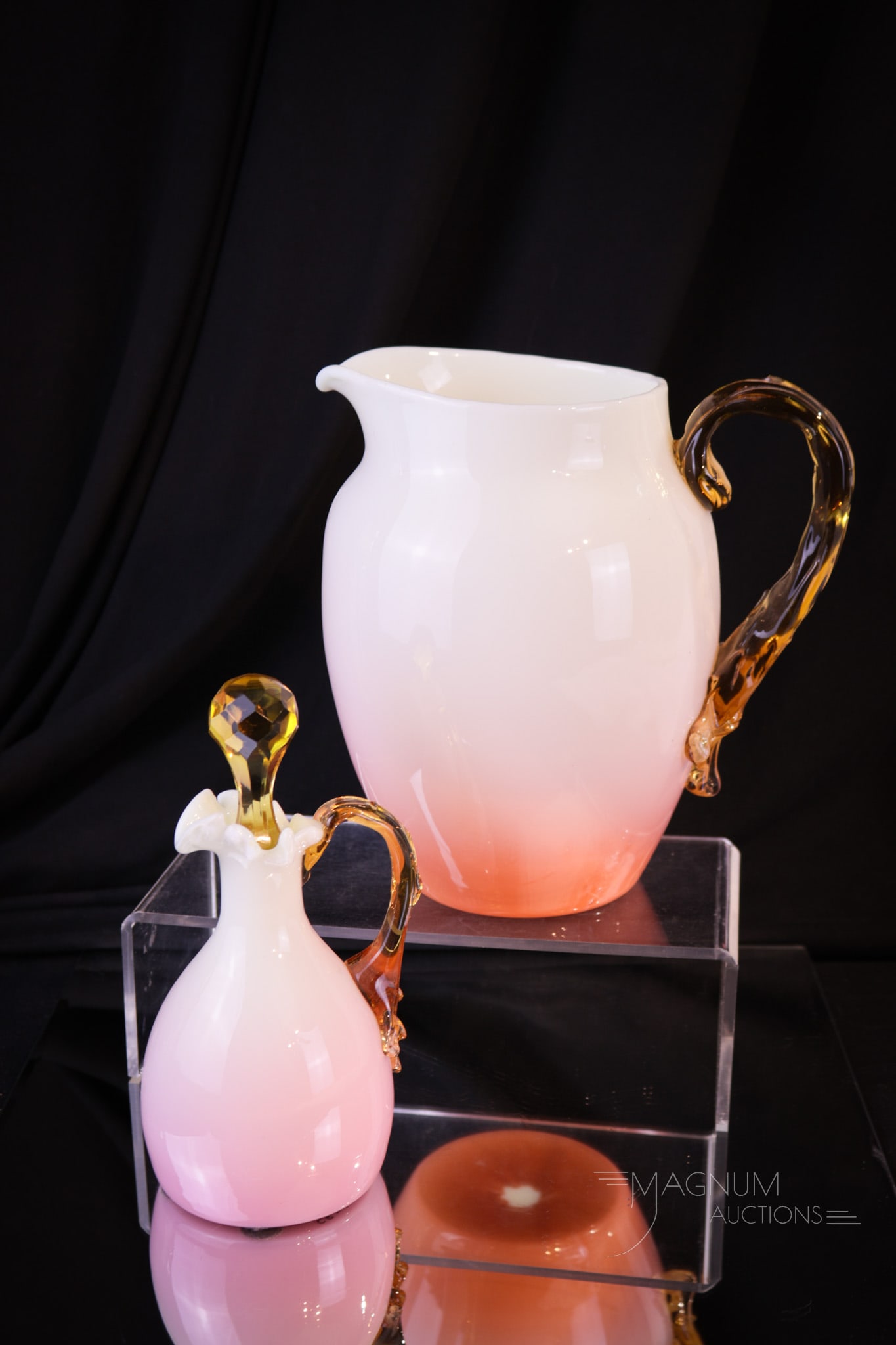 2 pc Lot Harrach Peachblow Victorian Uranium Glass Pitcher & Cruet: Two lovely and attractive finds in peachblow uranium opalescent with applied amber accents. Included in this lot is a water pitcher and matching tumbler. Both glow brilliantly under black light. Talle