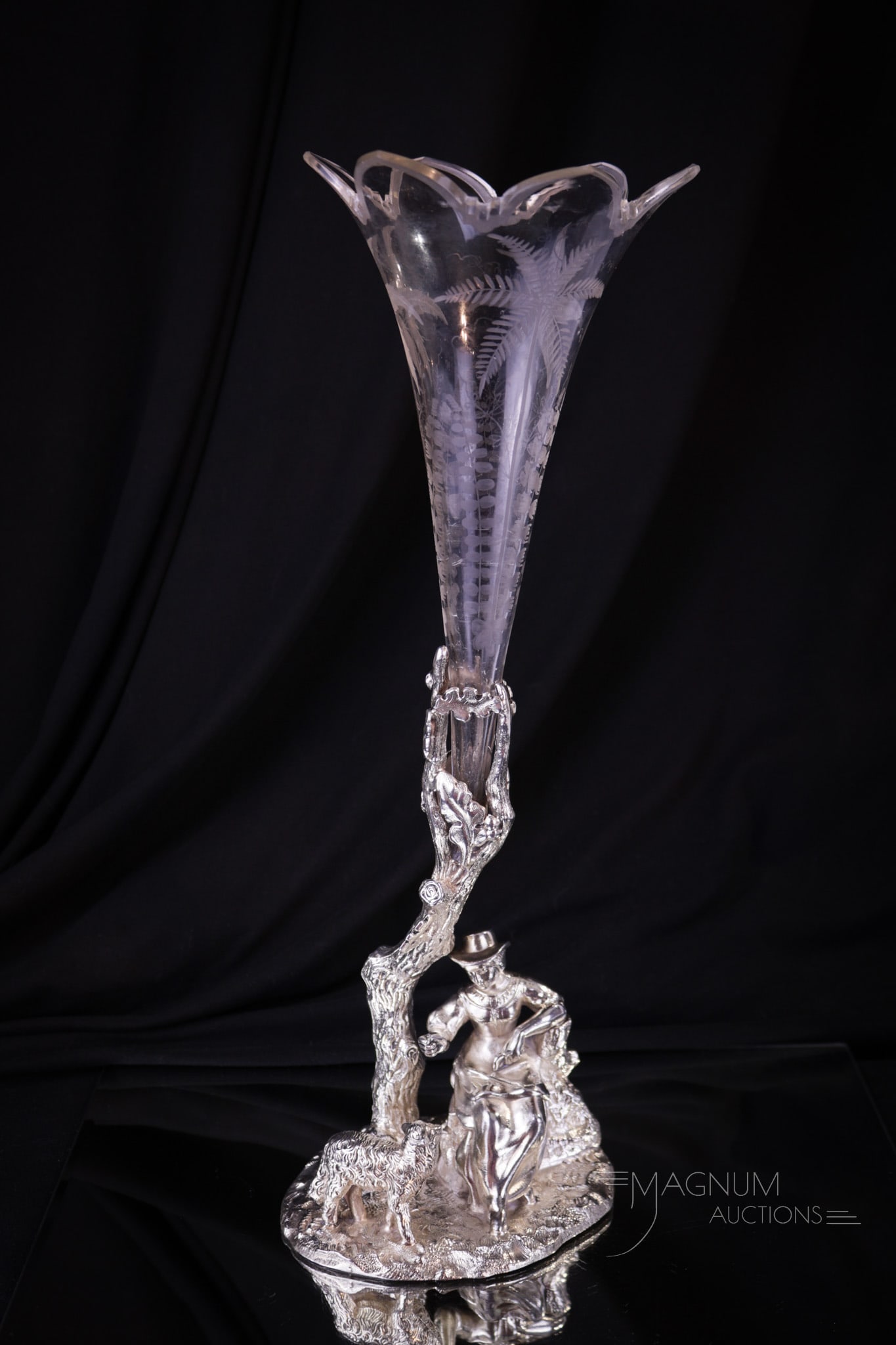 Reed & Barton Victorian Silverplate & Glass Figural Vase: Fine etched decoration compliments this glass vase set in original signed Reed & Barton Victorian silverplate base. Holder features a lady with her pooch and tree. Piece measures 13 1/4" tall complete