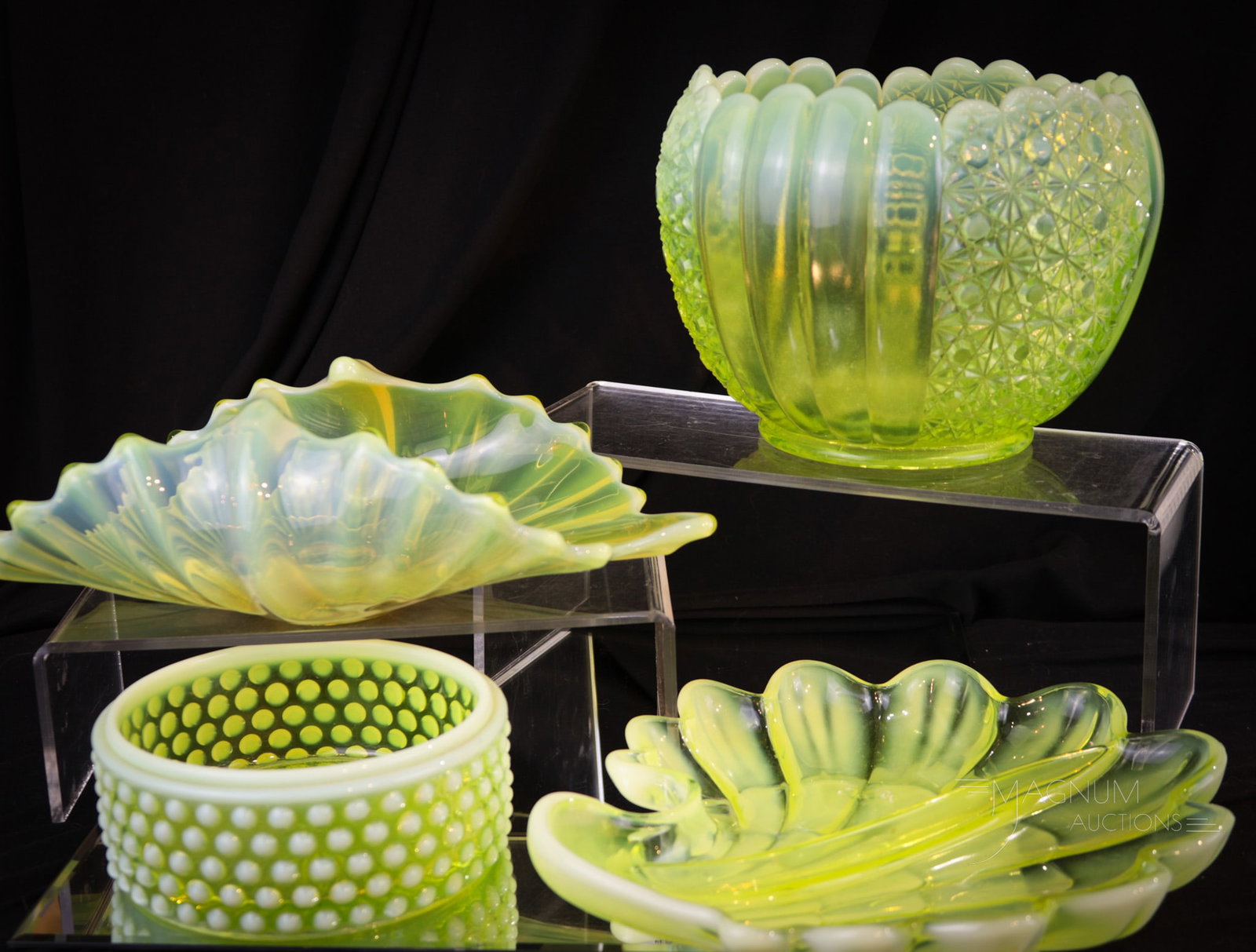 4 pc Lot Vaseline Uranium Glass: Four spendid finds in vaseline uranium glass. A large Daisy & Button rose bowl, a Fostoria Heirloom bowl, a Duncan Miller tray, and finally a hobnail bowl. Tallest measures 5".