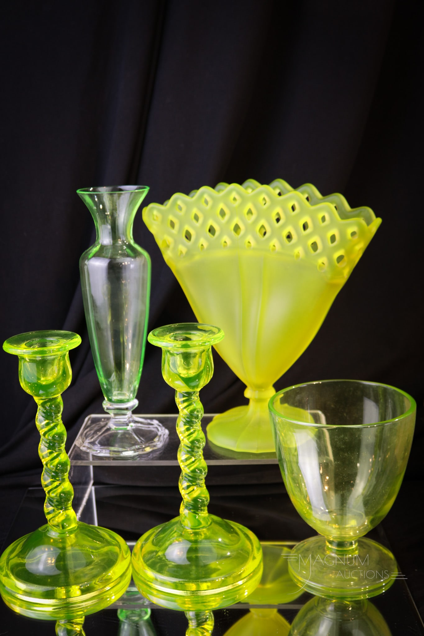 5 pc Lot Cambridge & Tiffin Vaseline Glass: Five fun finds in vaseline Cambridge and Tiffin glass.. Tallest measures 8". Lot includes candlesticks, vases, an an unusual candydish.