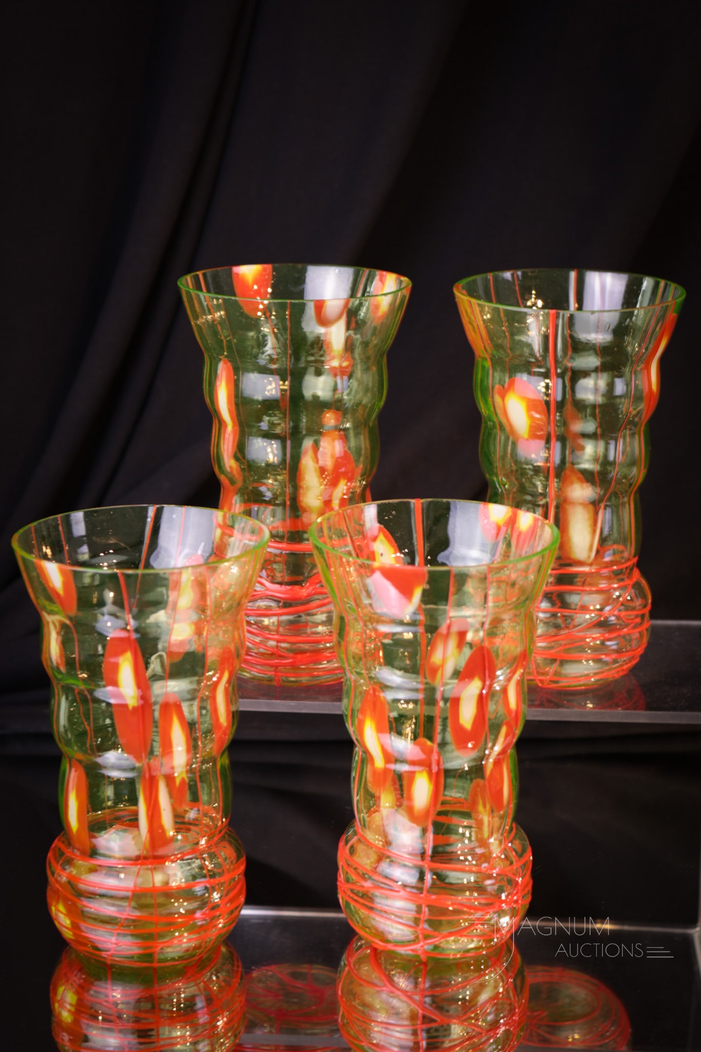 4 pc Lot Vaseline & Red Abstract Kralik Glass Tumblers: A matched set of vaseline and abstract red Kralik glass tumblers. Each measures 5 1/2" tall.